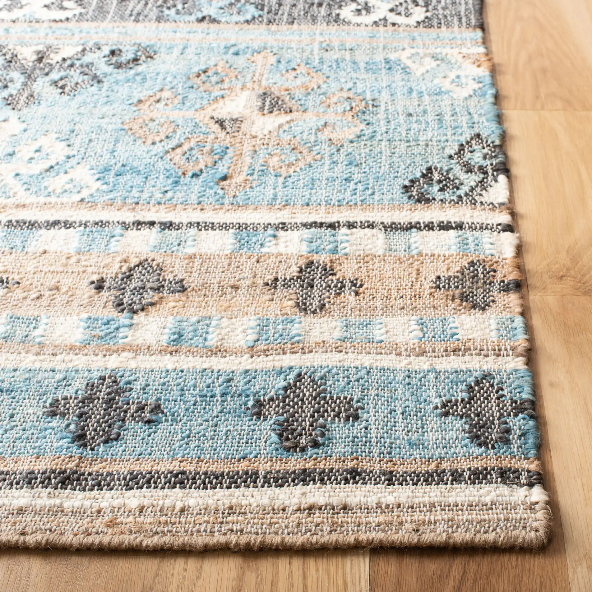 Kilim Banded Flatweave Jute Rug in Blue / Ivory in a styled room