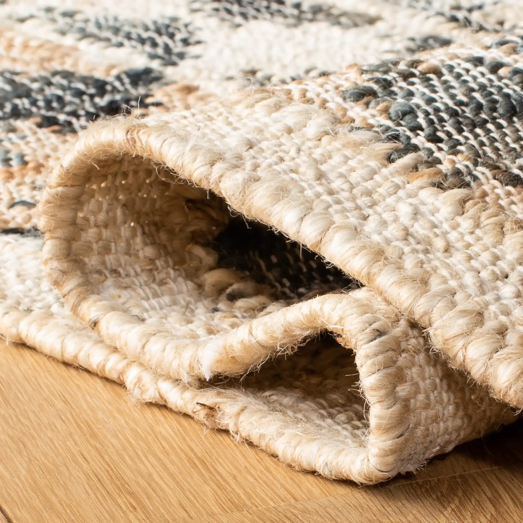 Kilim Bordered Diamond Flatweave Jute Rug in Ivory / Gray in a styled room