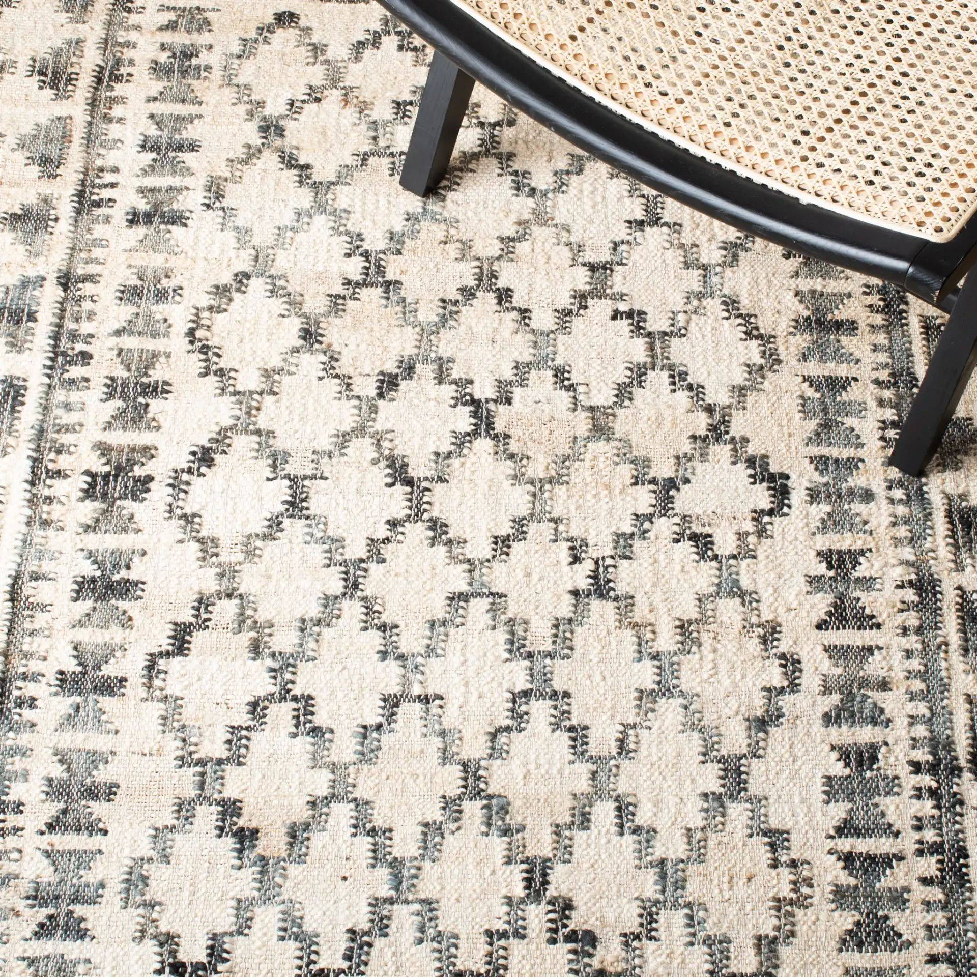 Kilim Bordered Diamond Flatweave Jute Rug in Ivory / Gray in a styled room