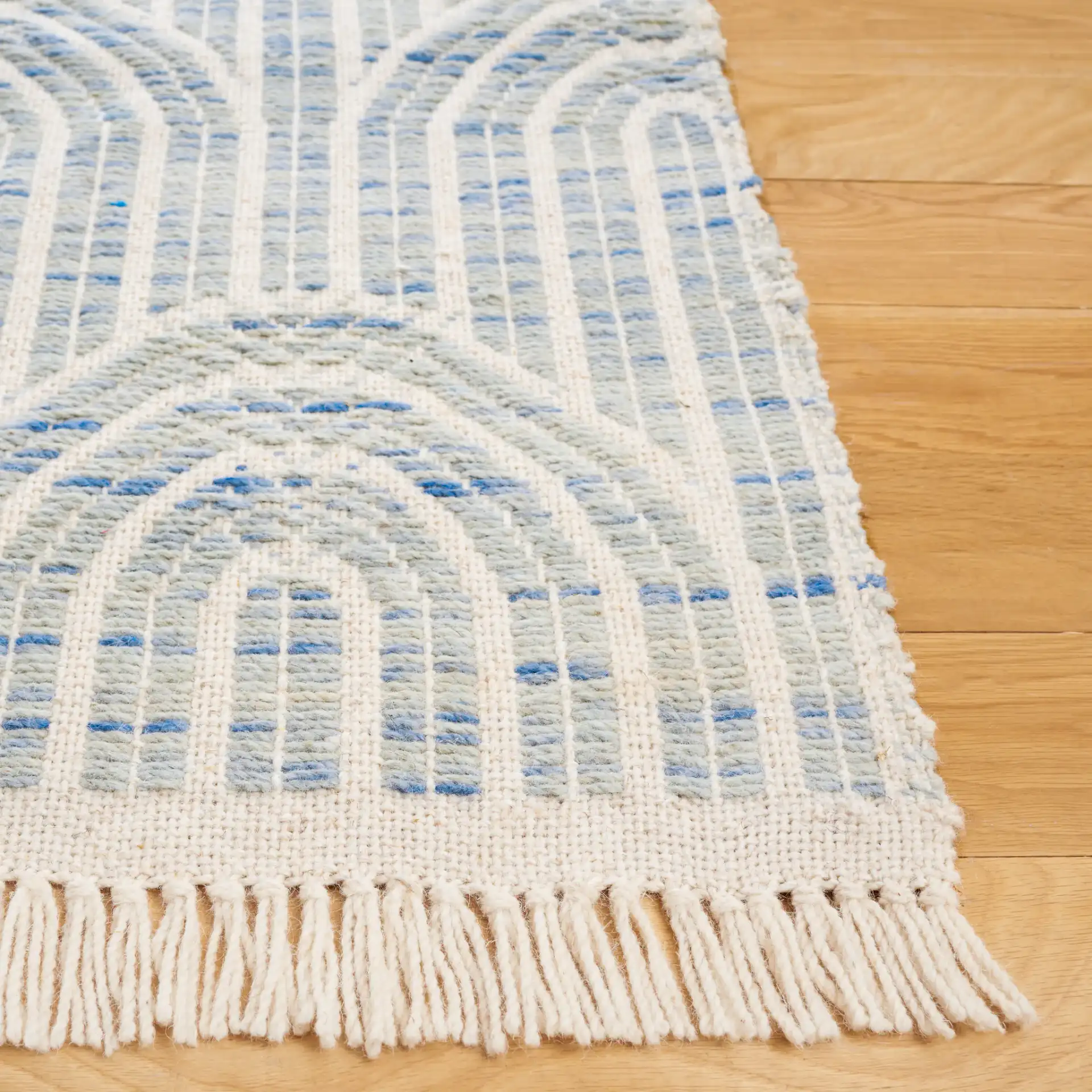 Kilim Arch Hand-Woven Wool Rug in Blue / Ivory in a styled room