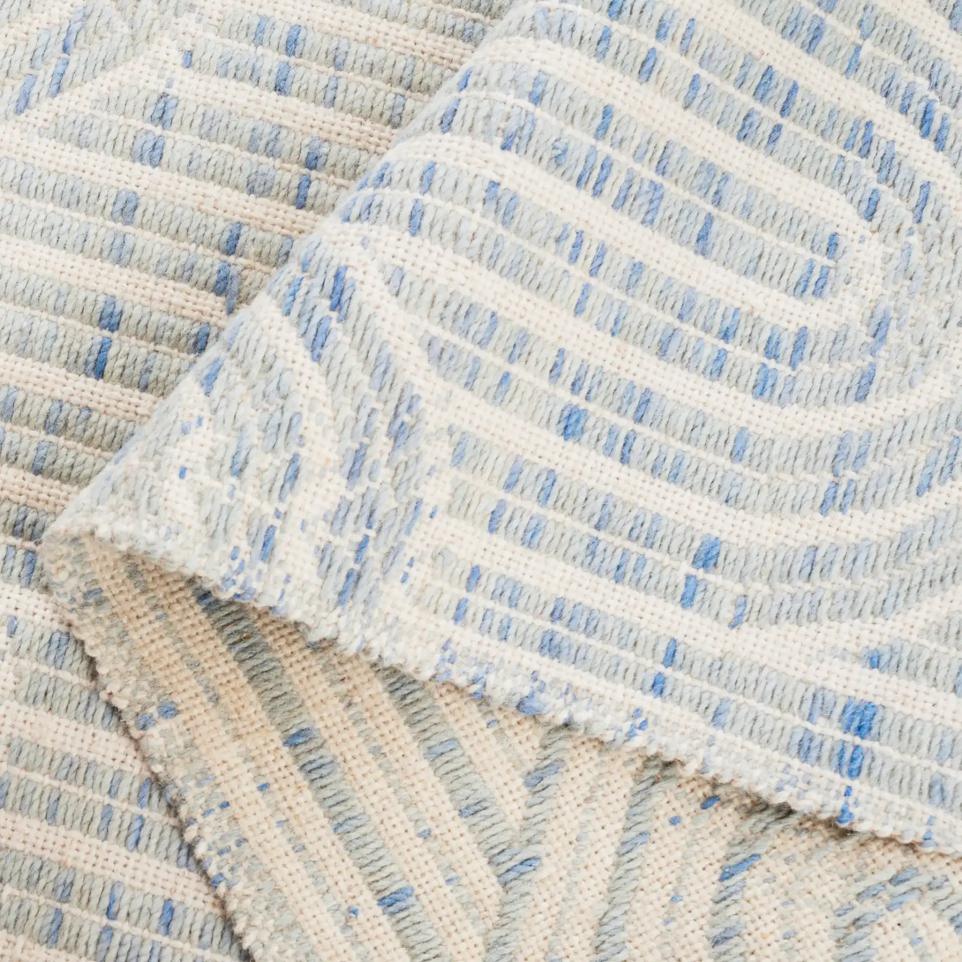 Kilim Arch Hand-Woven Wool Rug in Blue / Ivory in a styled room