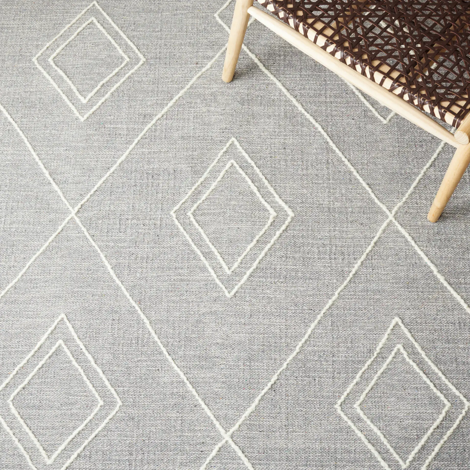 Kilim Nested Diamond Hand-Woven Rug in Gray / Ivory in a styled room