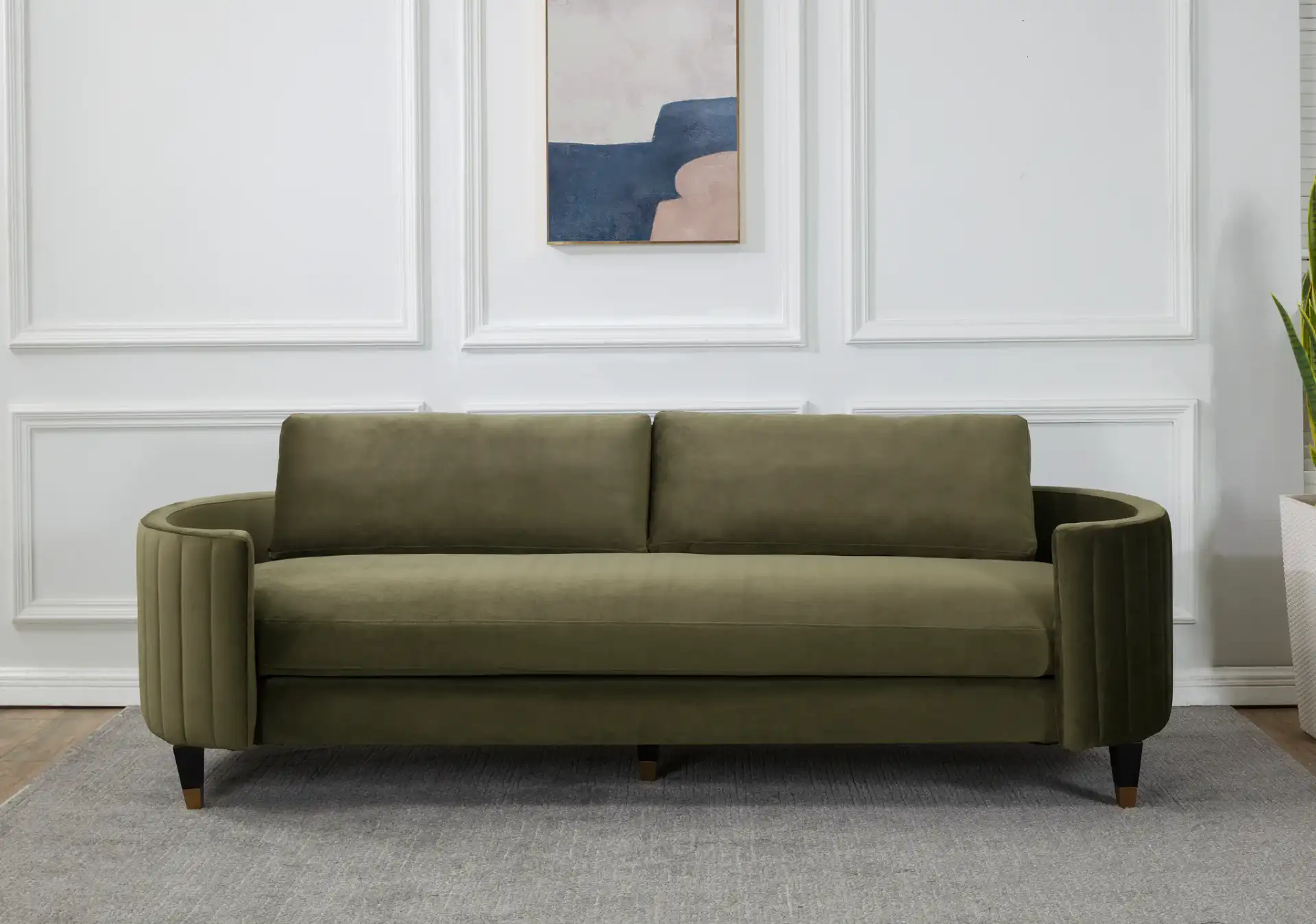 Winford Velvet Sofa in Olive / Black in a styled room