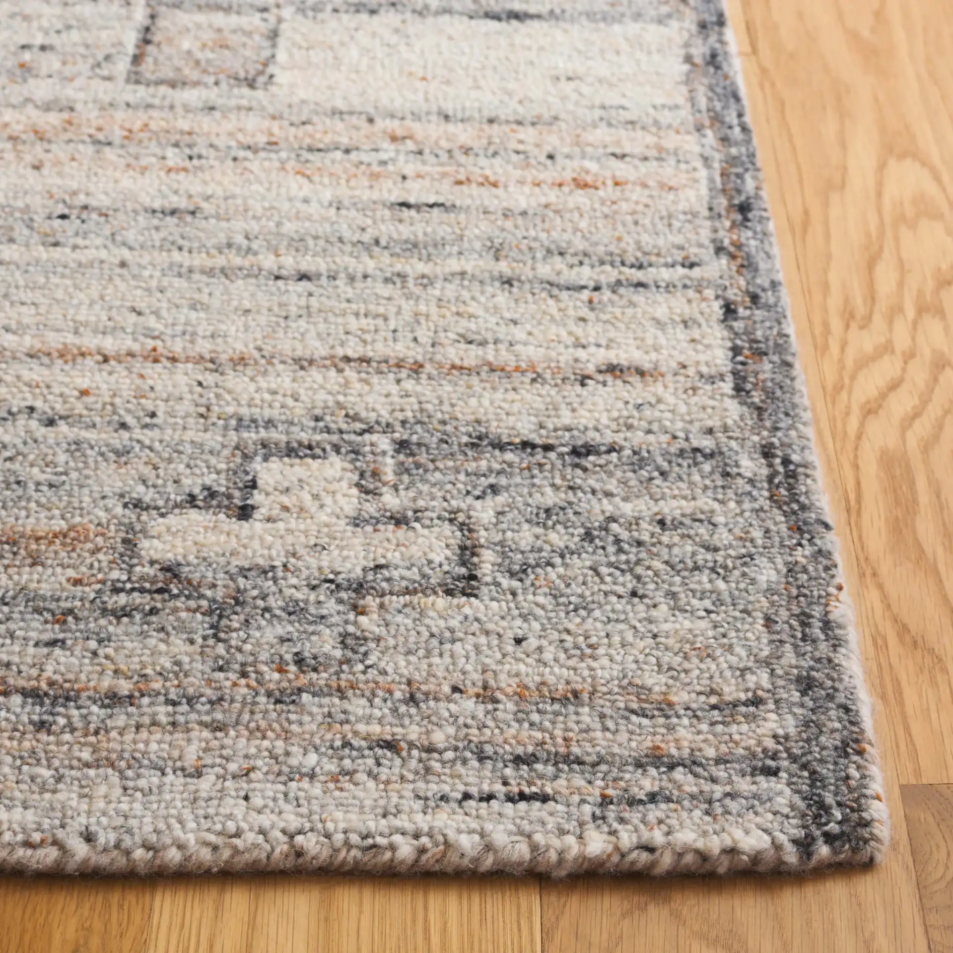 Kenya Tribal Medallion Hand-Tufted Wool Rug in Brown / Beige in a styled room