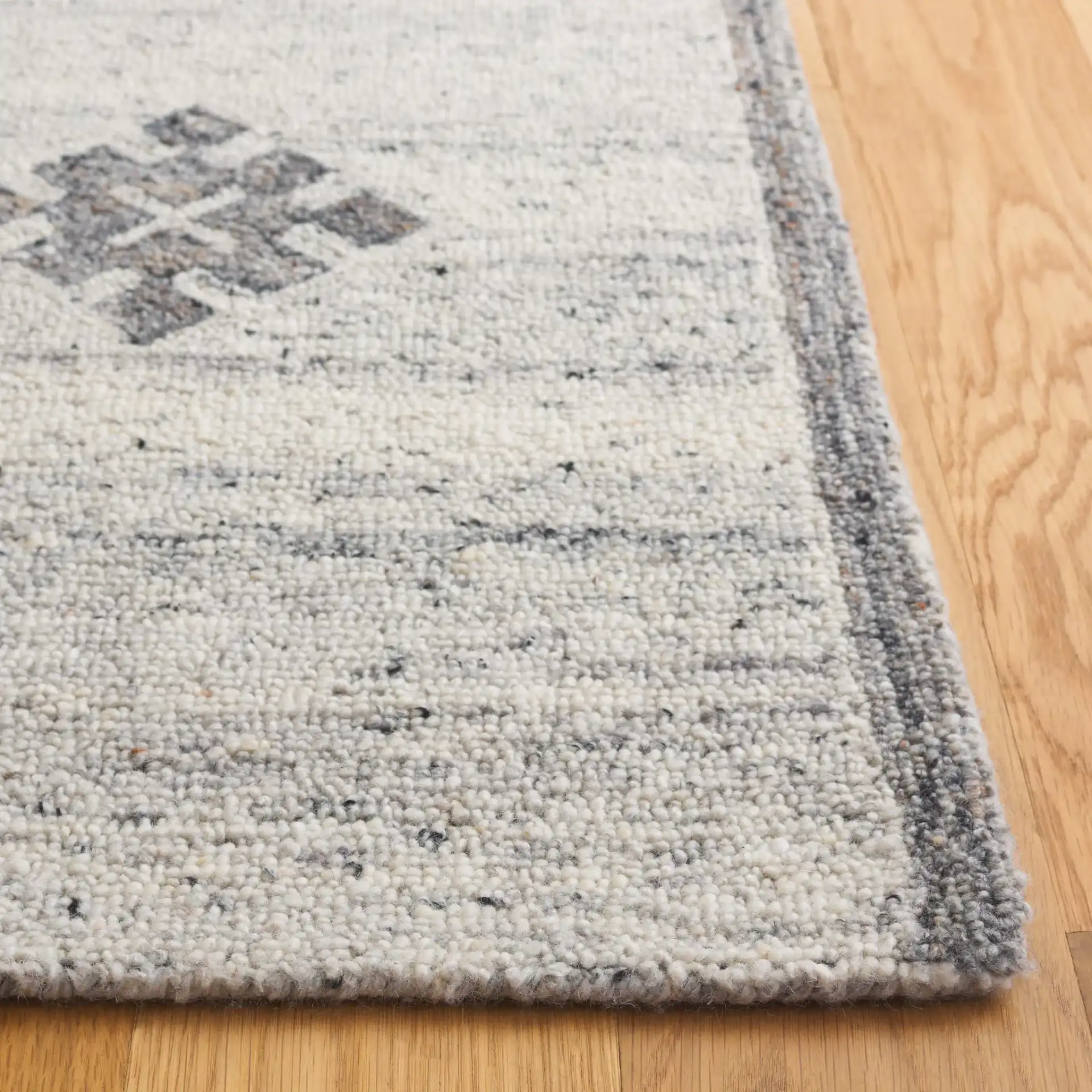 Kenya Striped Panel Hand-Tufted Wool Rug in Brown / Beige in a styled room