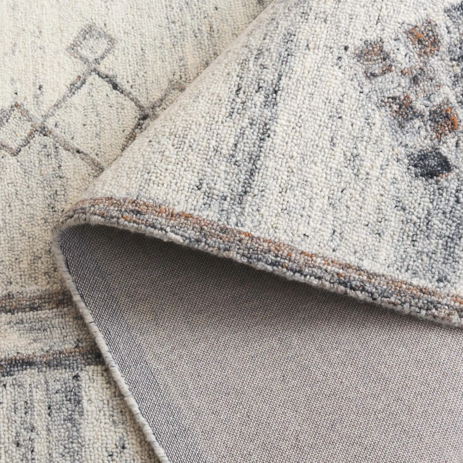 Kenya Striped Panel Hand-Tufted Wool Rug in Brown / Beige in a styled room