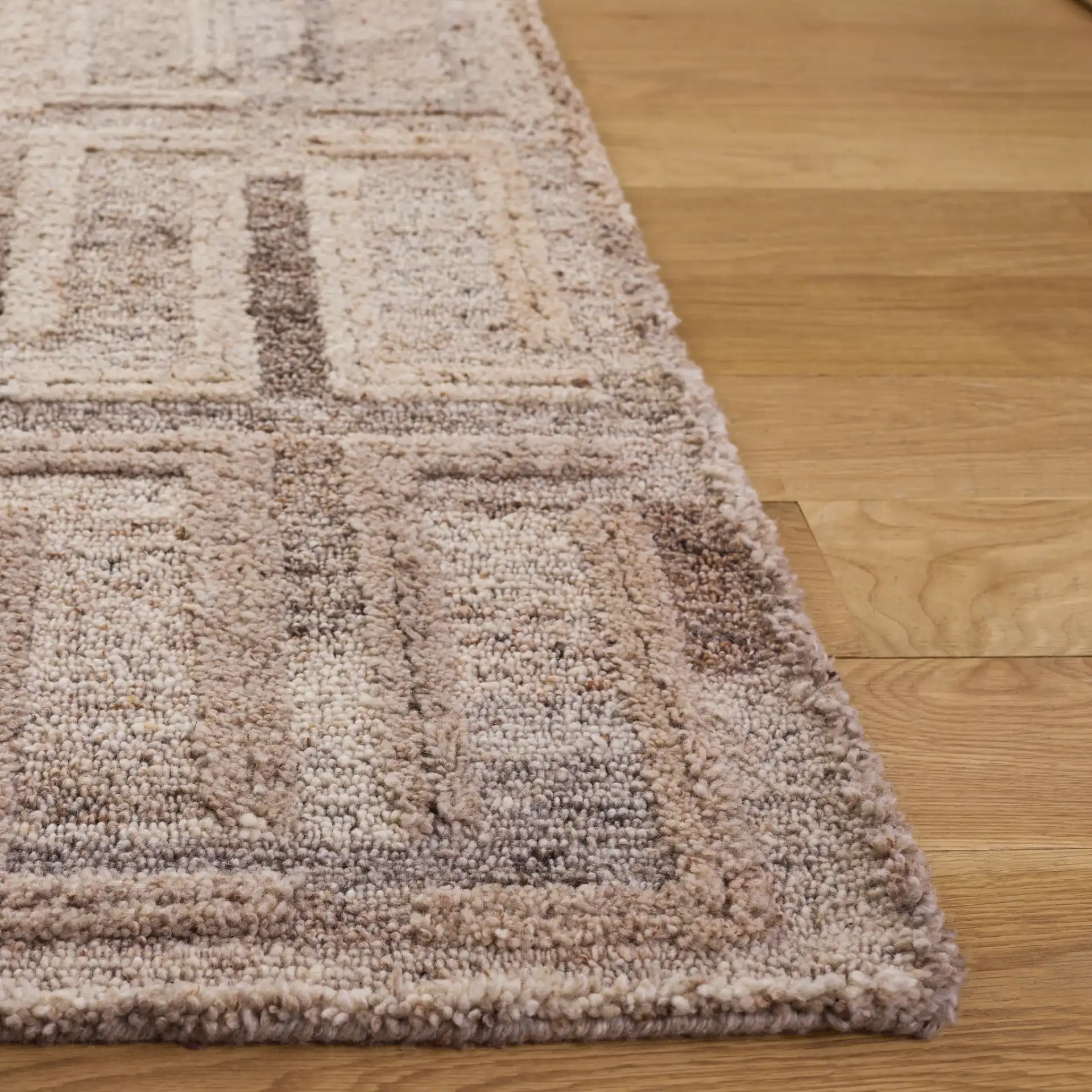 Kenya Modern Geometric Hand-Tufted Wool Rug in Brown / Gray in a styled room