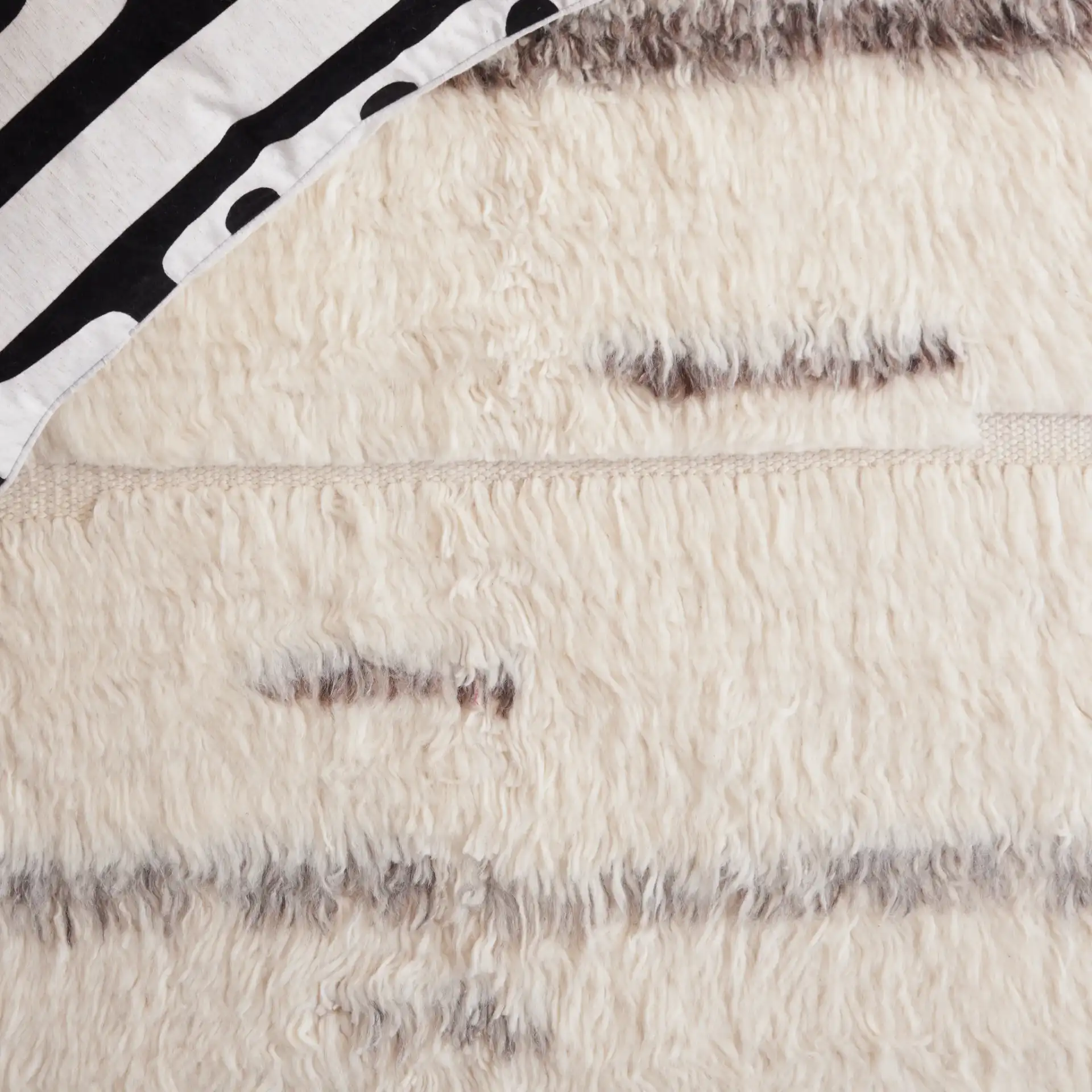 Kenya Broken Stripe Shag Wool Rug in Gray / Ivory in a styled room
