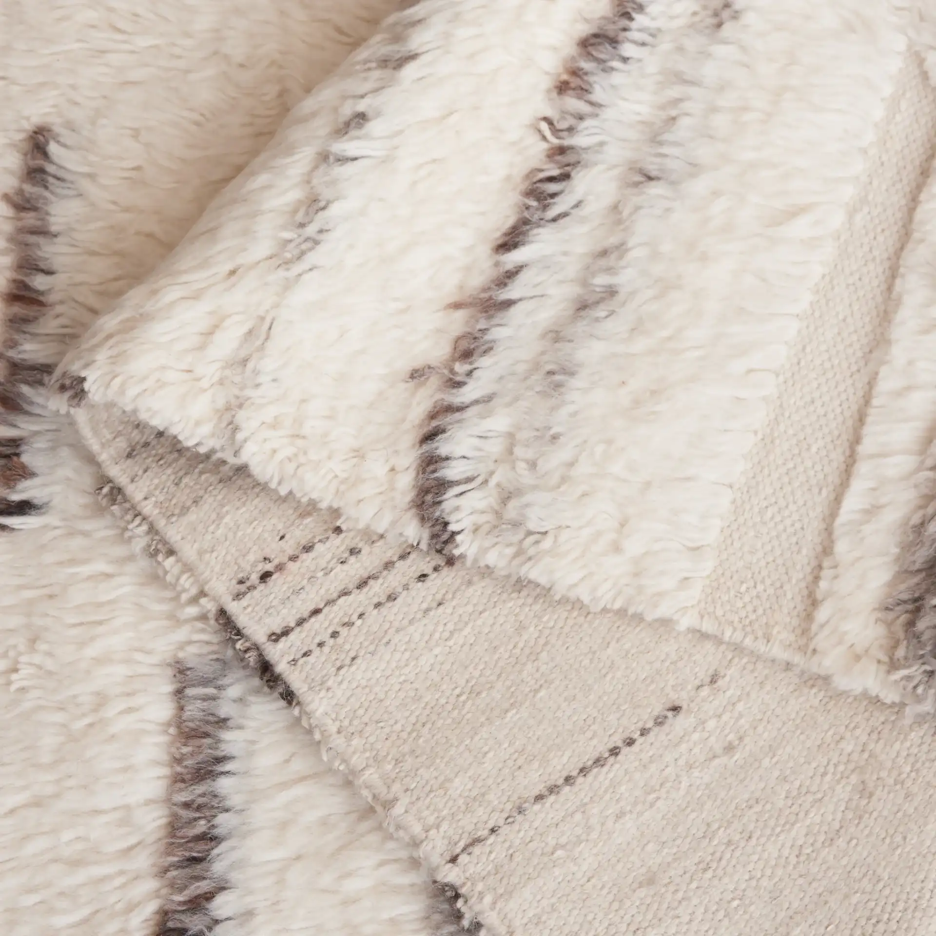 Kenya Broken Stripe Shag Wool Rug in Gray / Ivory in a styled room