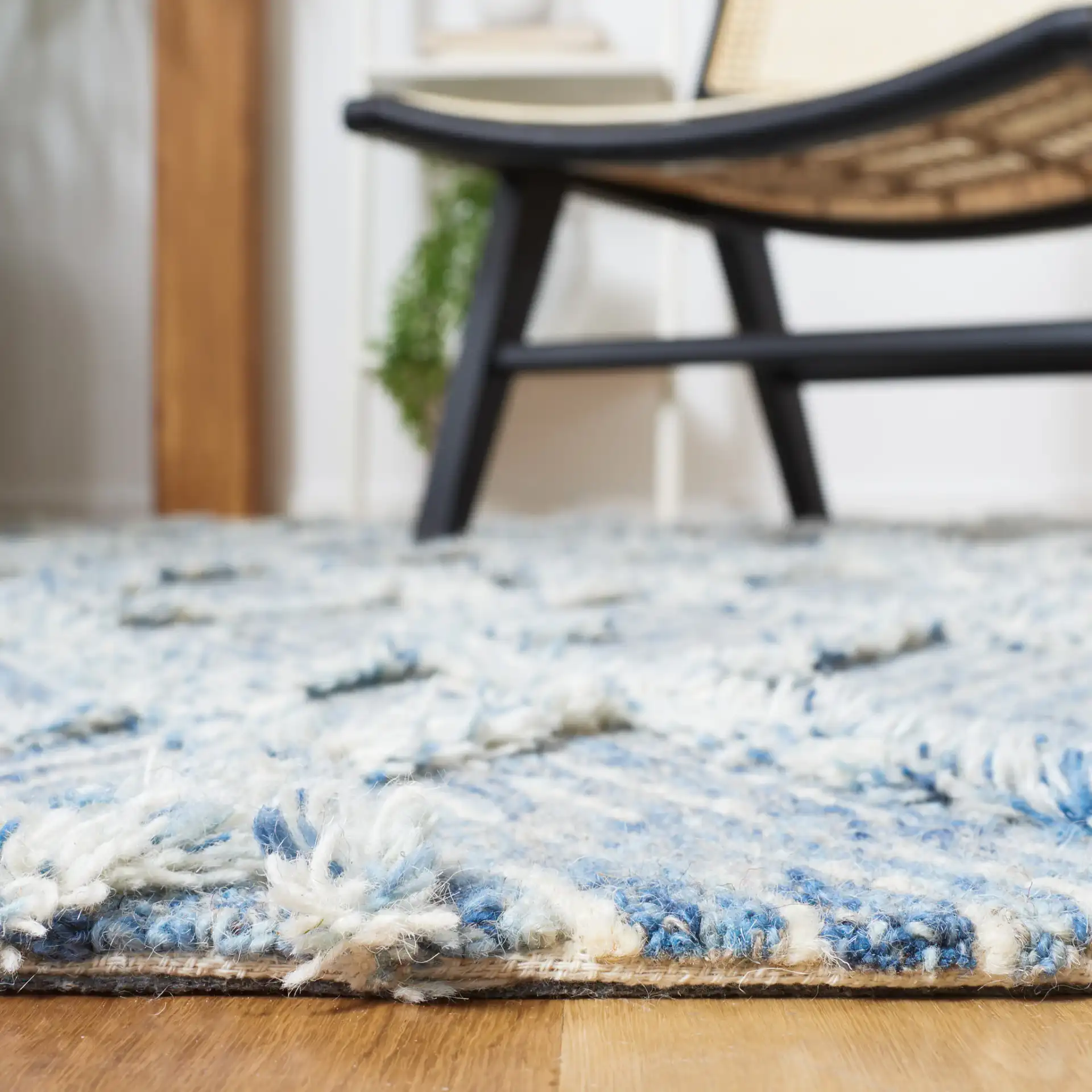 Kenya Nested Diamond Trellis Hand-Tufted Wool Rug in Blue / Ivory in a styled room