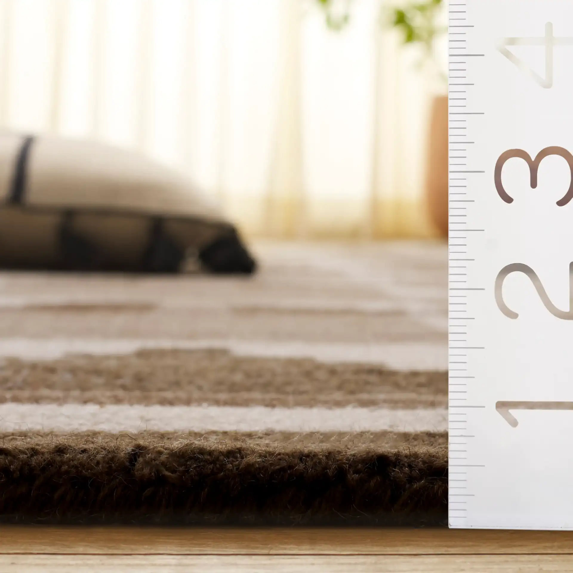 Kenya Stepped Chevron Hand-Tufted Wool Rug in Brown / Ivory in a styled room
