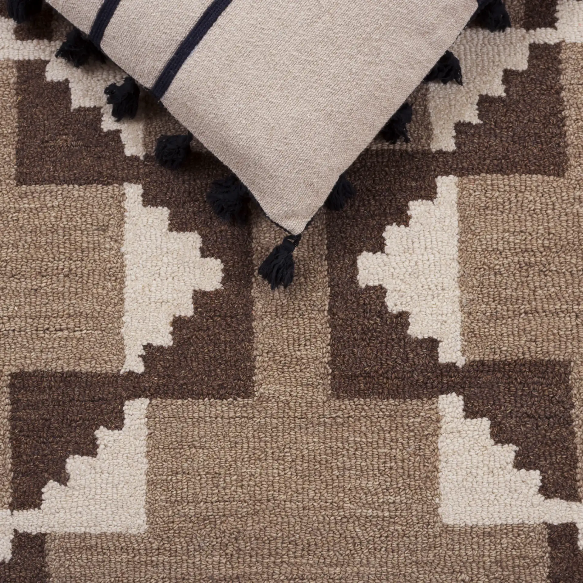 Kenya Stepped Chevron Hand-Tufted Wool Rug in Brown / Ivory in a styled room