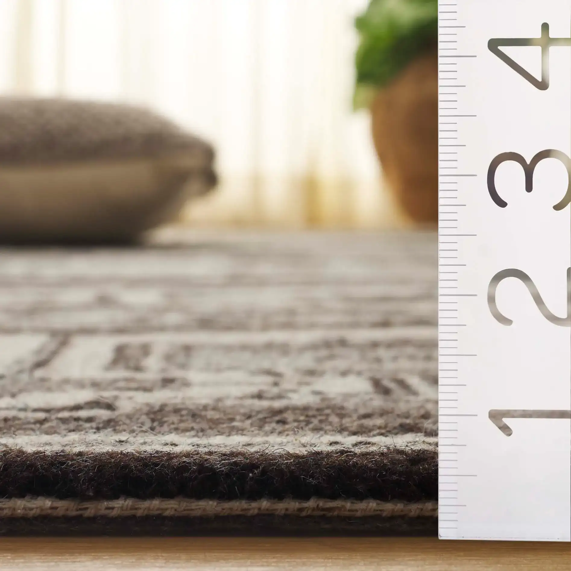 Kenya Stepped Medallion Hand-Tufted Wool Rug in Brown / Ivory in a styled room