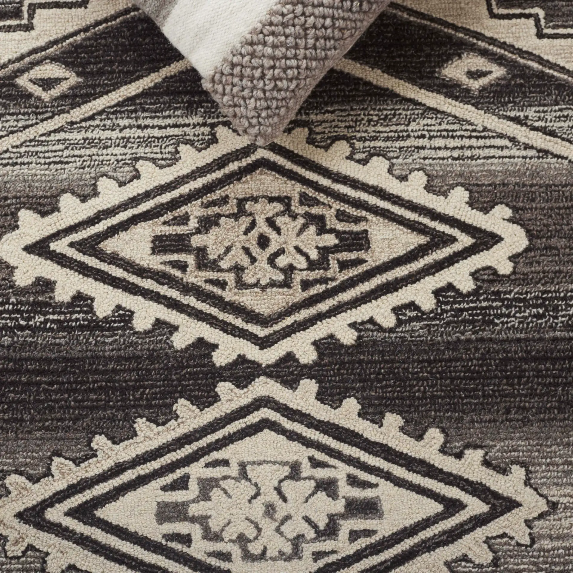 Kenya Stepped Medallion Hand-Tufted Wool Rug in Brown / Ivory in a styled room