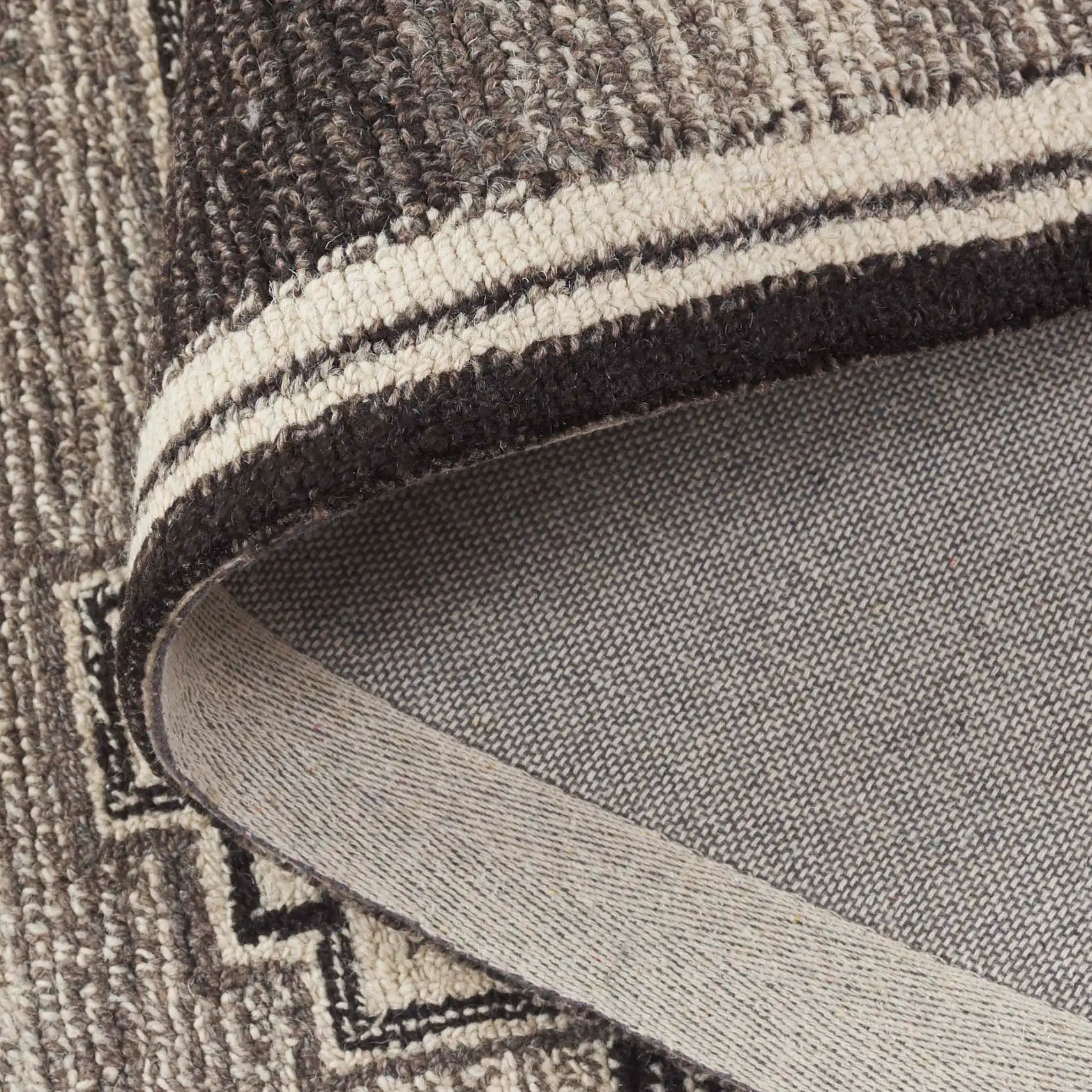 Kenya Stepped Medallion Hand-Tufted Wool Rug in Brown / Ivory in a styled room