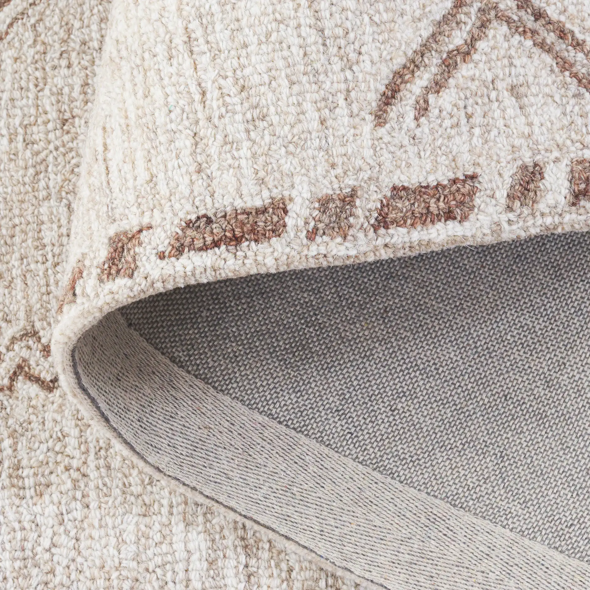 Kenya Tribal Diamond Hand-Tufted Wool Rug in Brown / Beige in a styled room