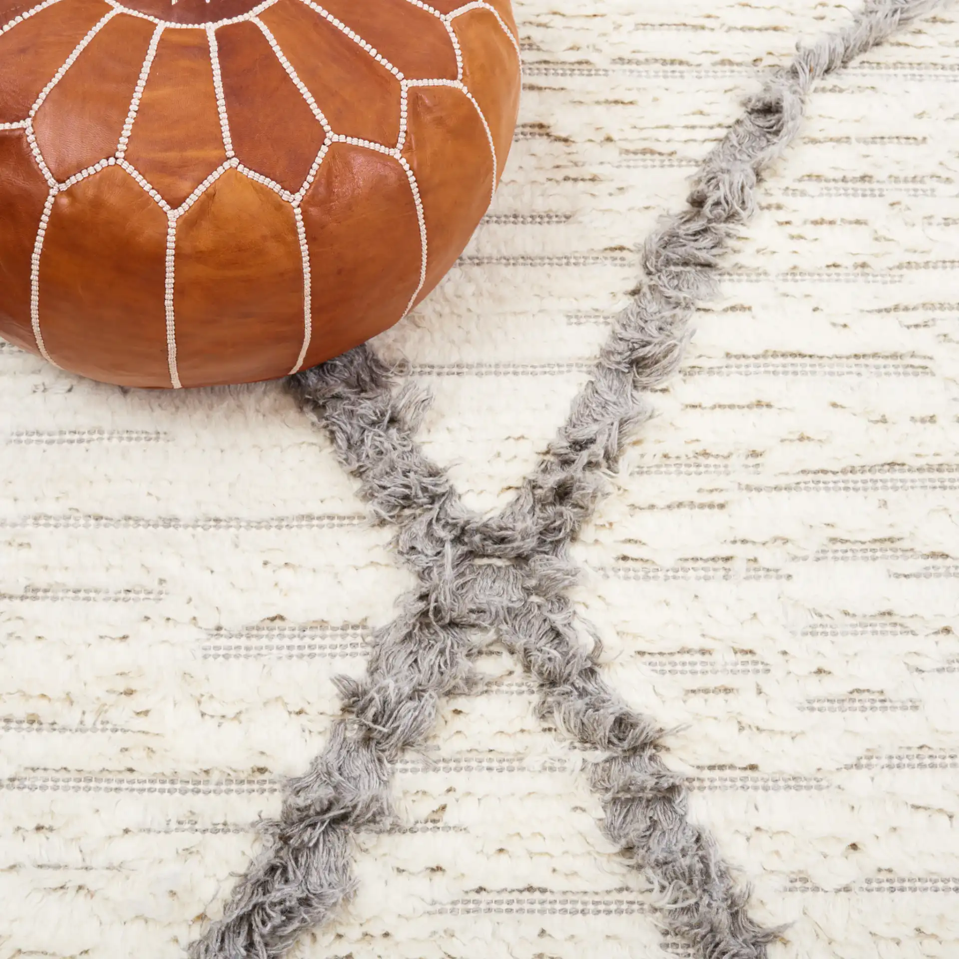 Kenya Textured Diamond Trellis Hand-Woven Shag Wool Rug in Ivory / Gray in a styled room