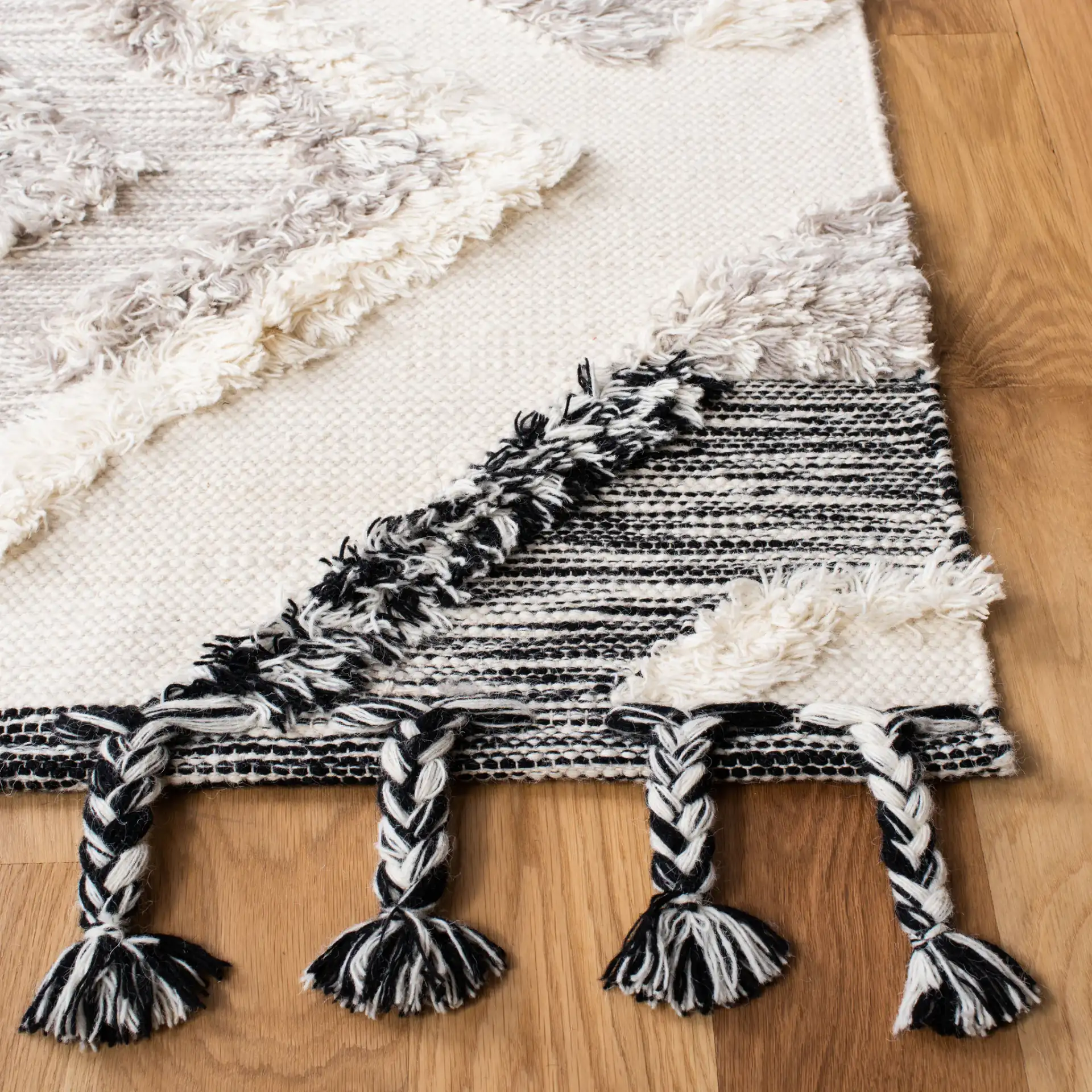 Kenya Diamond Hand-Woven Shag Wool Rug in Gray / Black in a styled room
