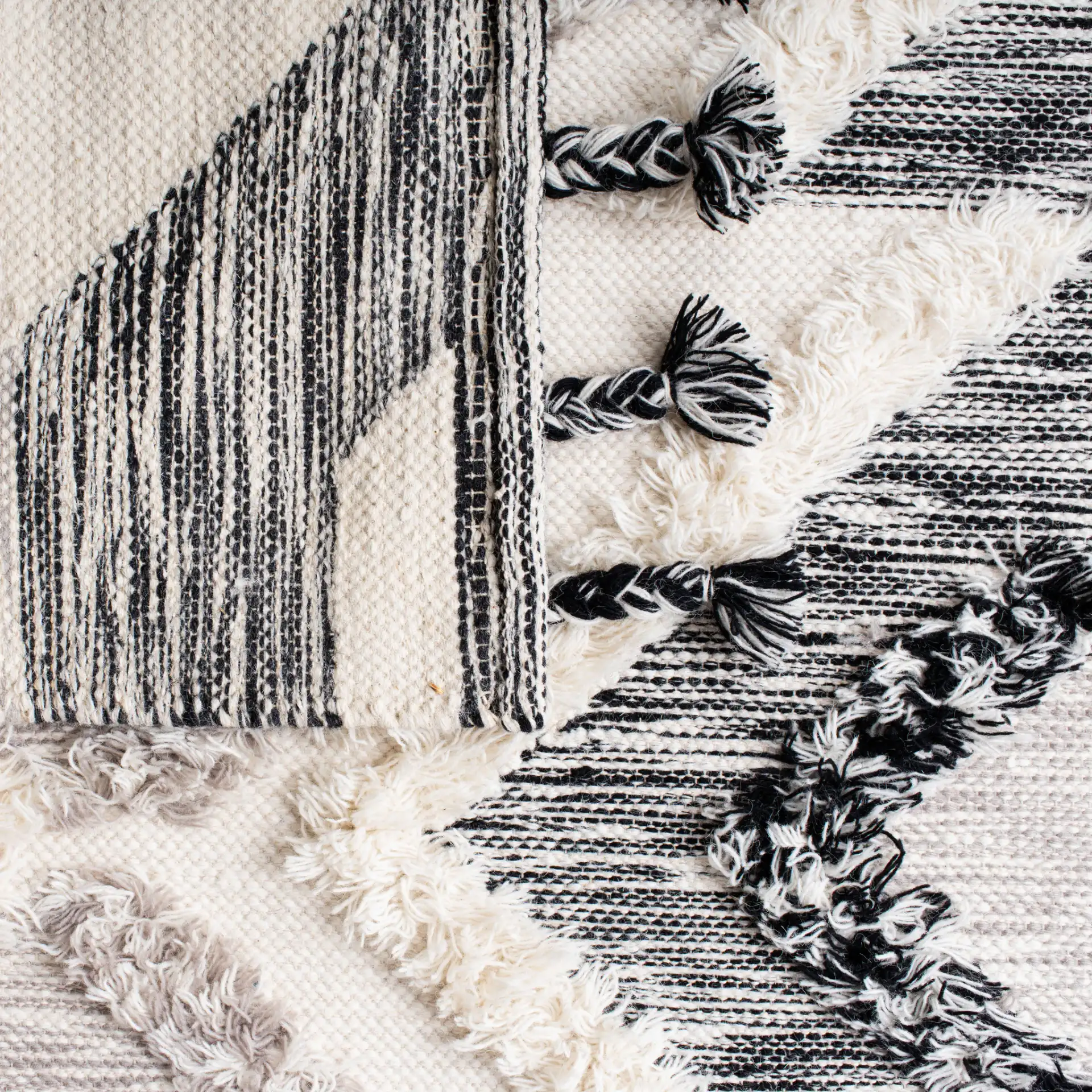 Kenya Diamond Hand-Woven Shag Wool Rug in Gray / Black in a styled room