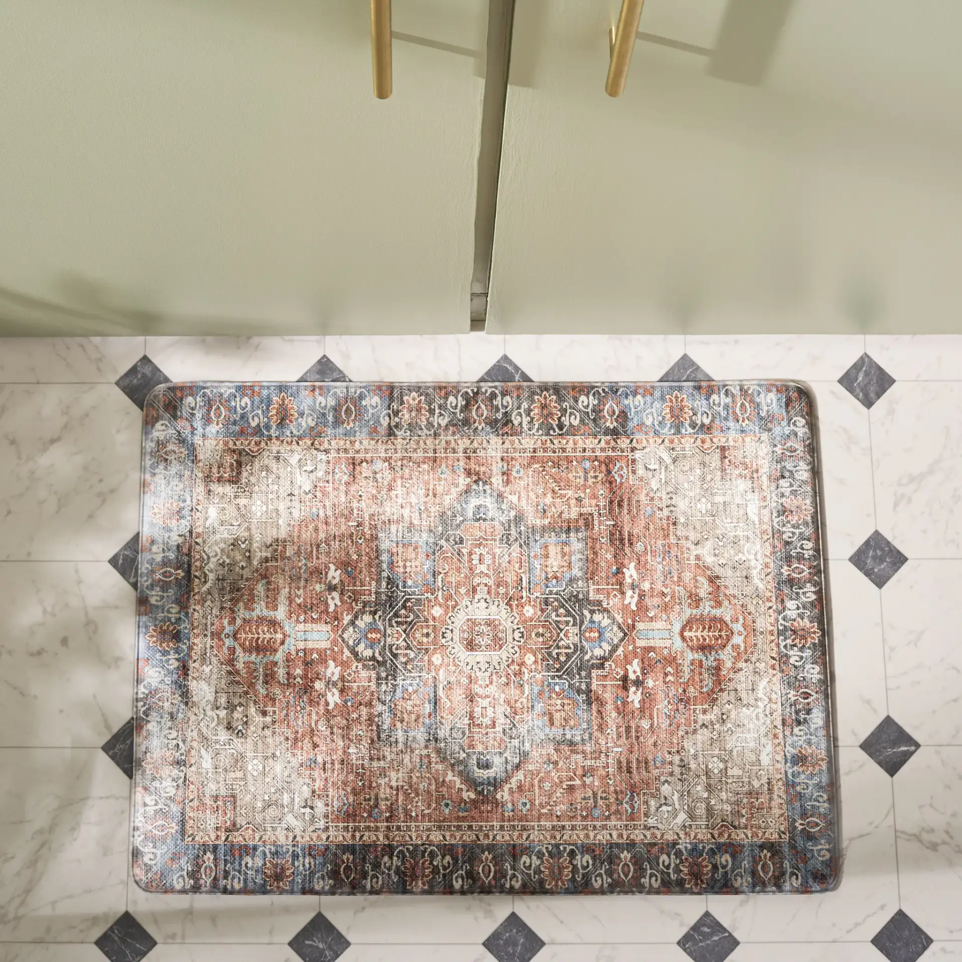 Evoke Medallion Kitchen Mat in Rust / Aqua in a styled room