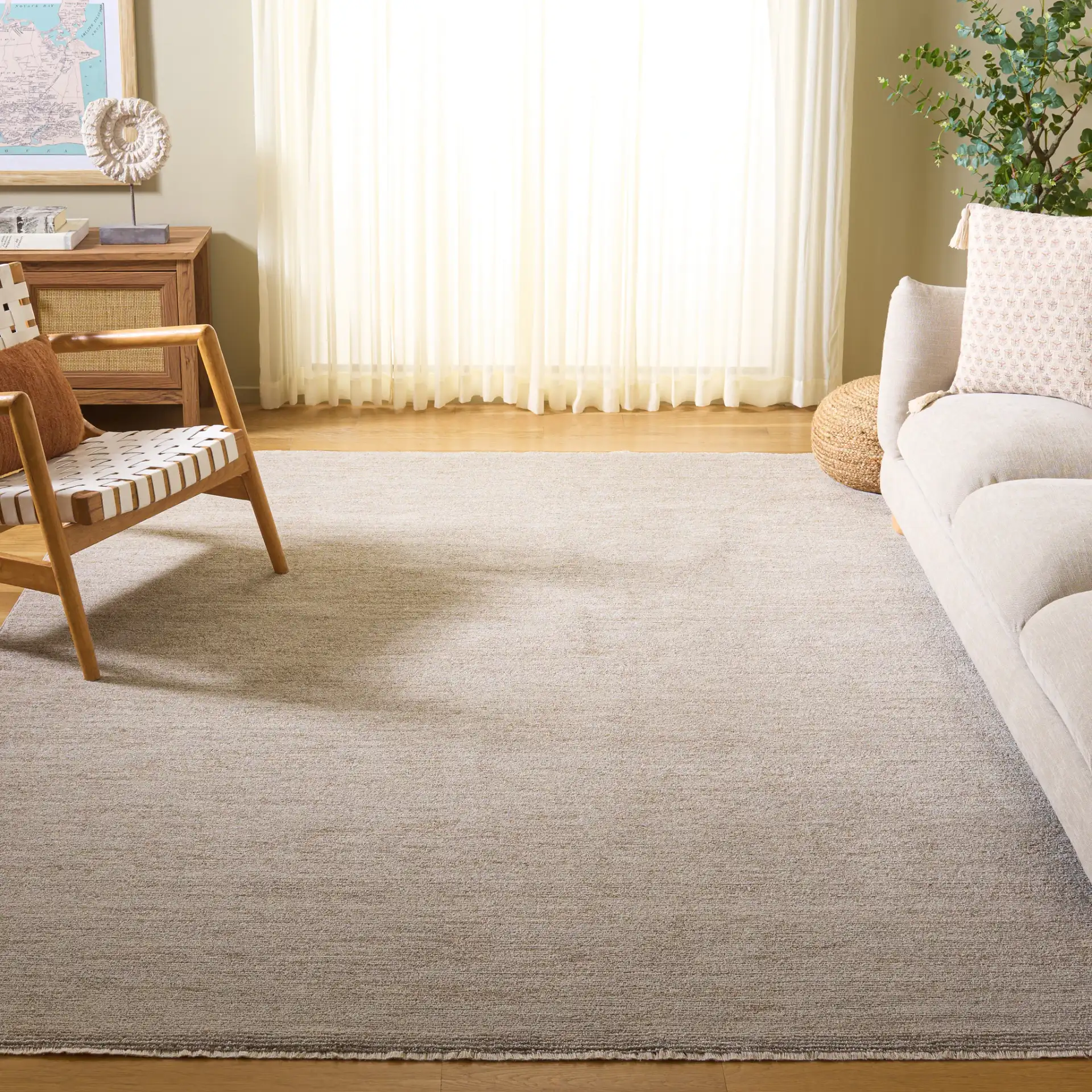 Lasa Textured Solid Rug in Beige in a styled room