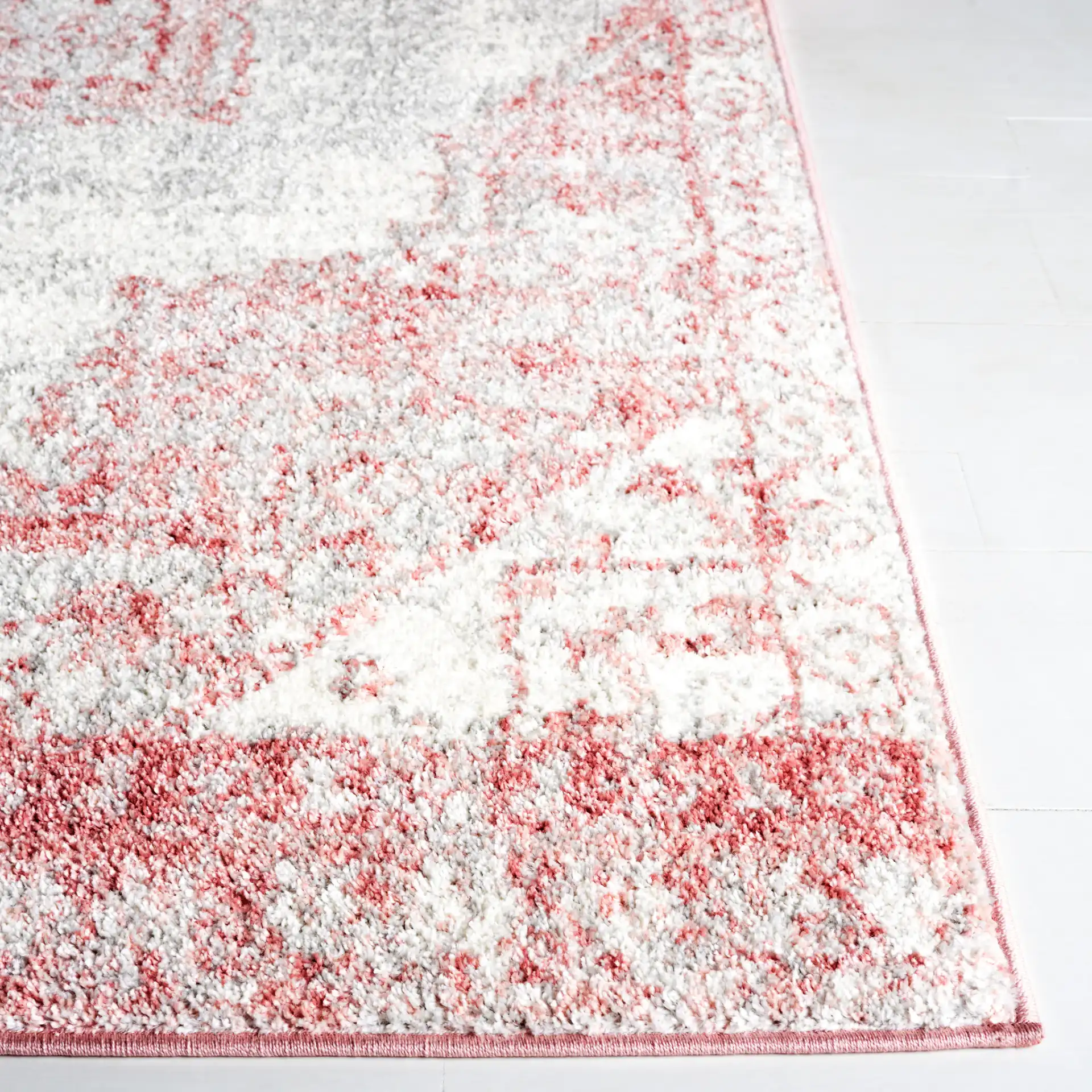 Layla Medallion Bordered Rug in Ivory Gray / Pink in a styled room