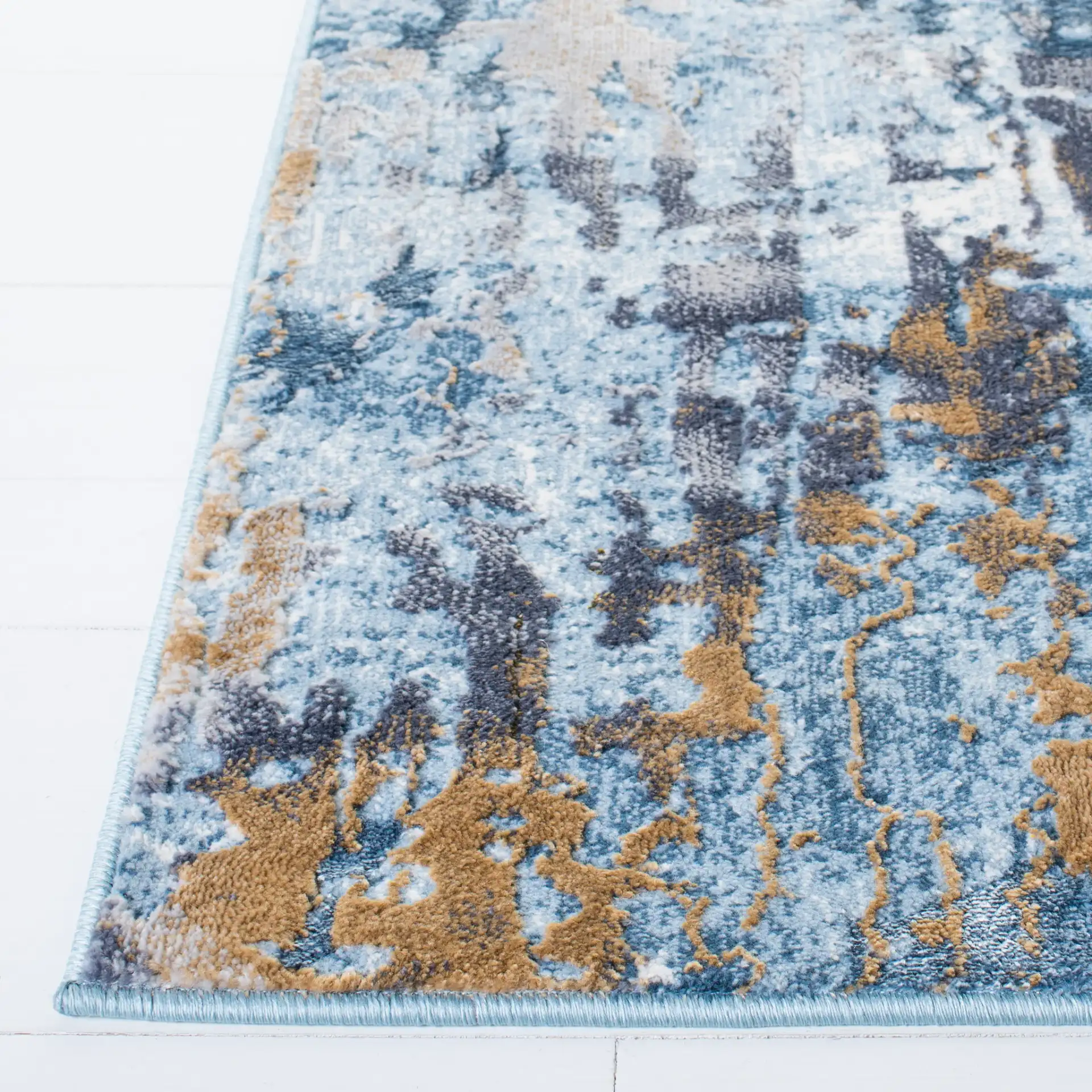 Lagoon Abstract Drip Rug in Gray / Blue in a styled room