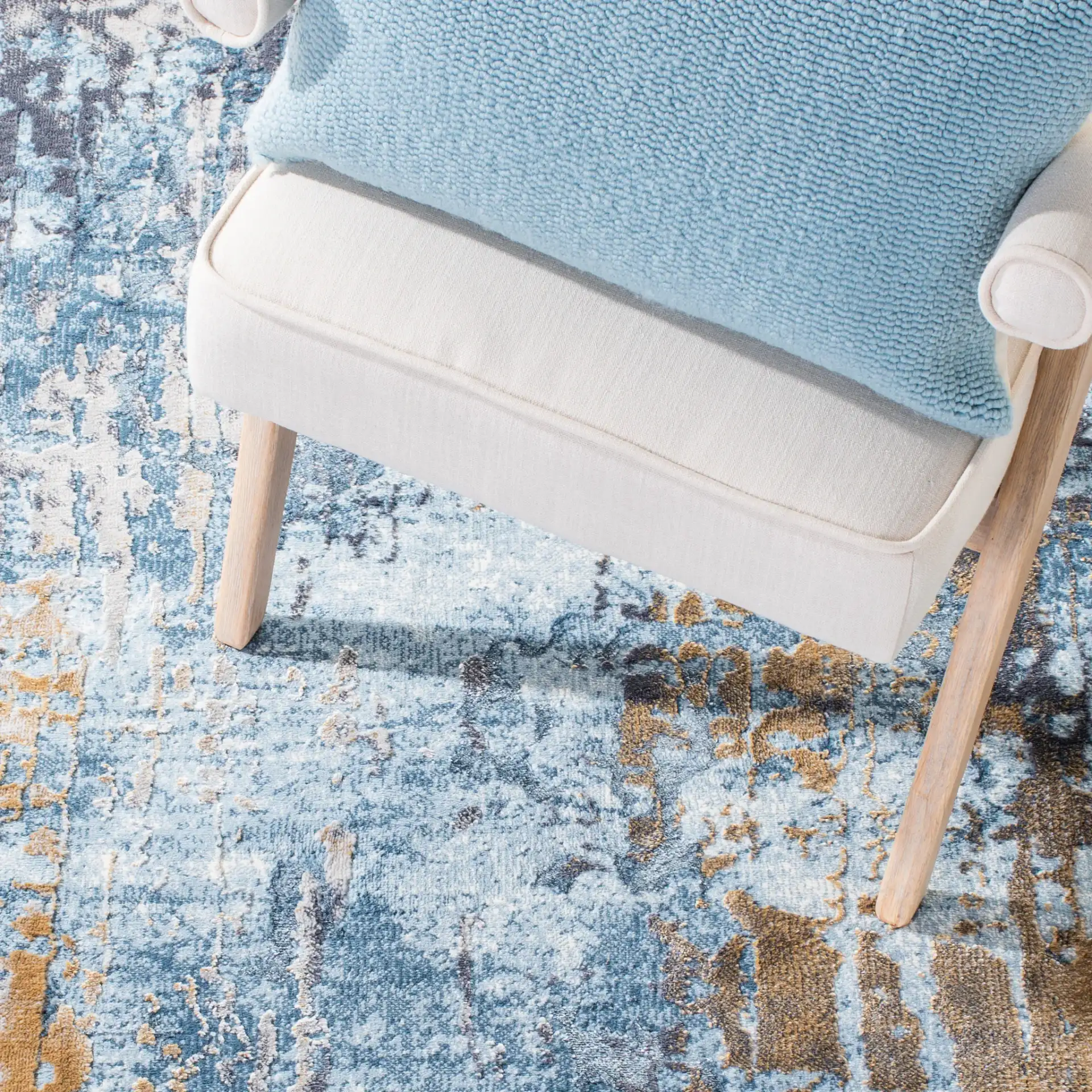 Lagoon Abstract Drip Rug in Gray / Blue in a styled room