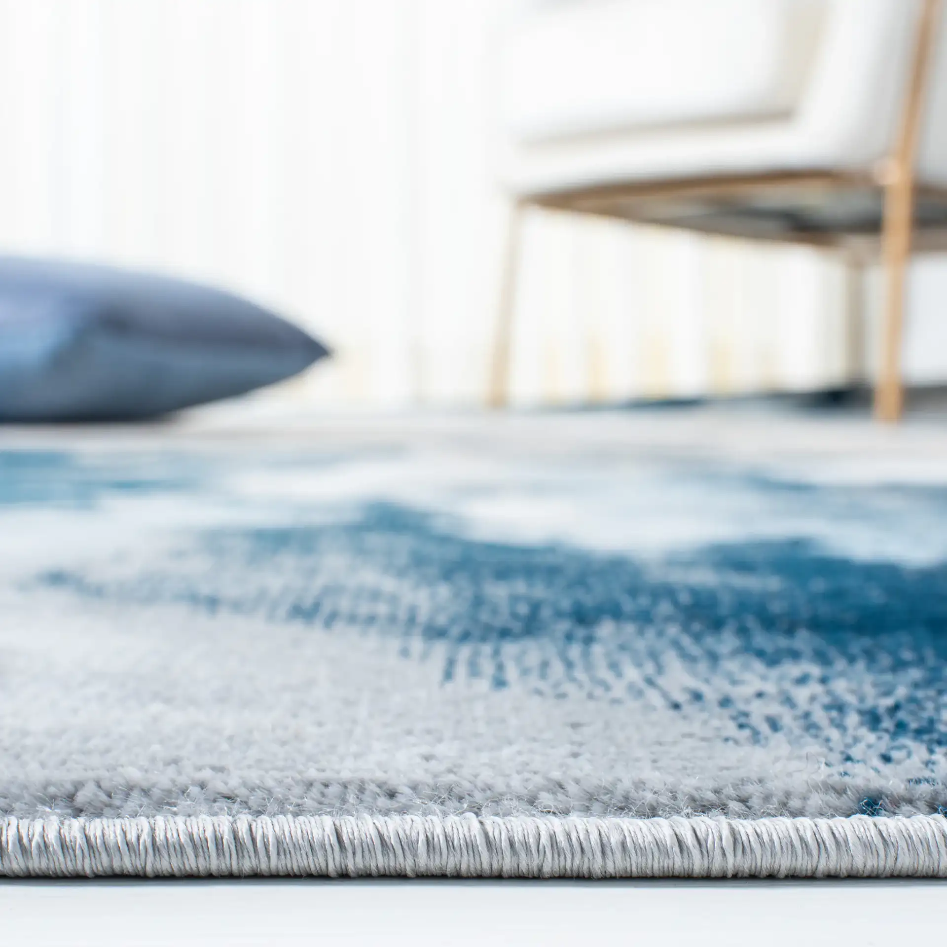 Lagoon Abstract Cloud Rug in Blue / Beige in a styled room