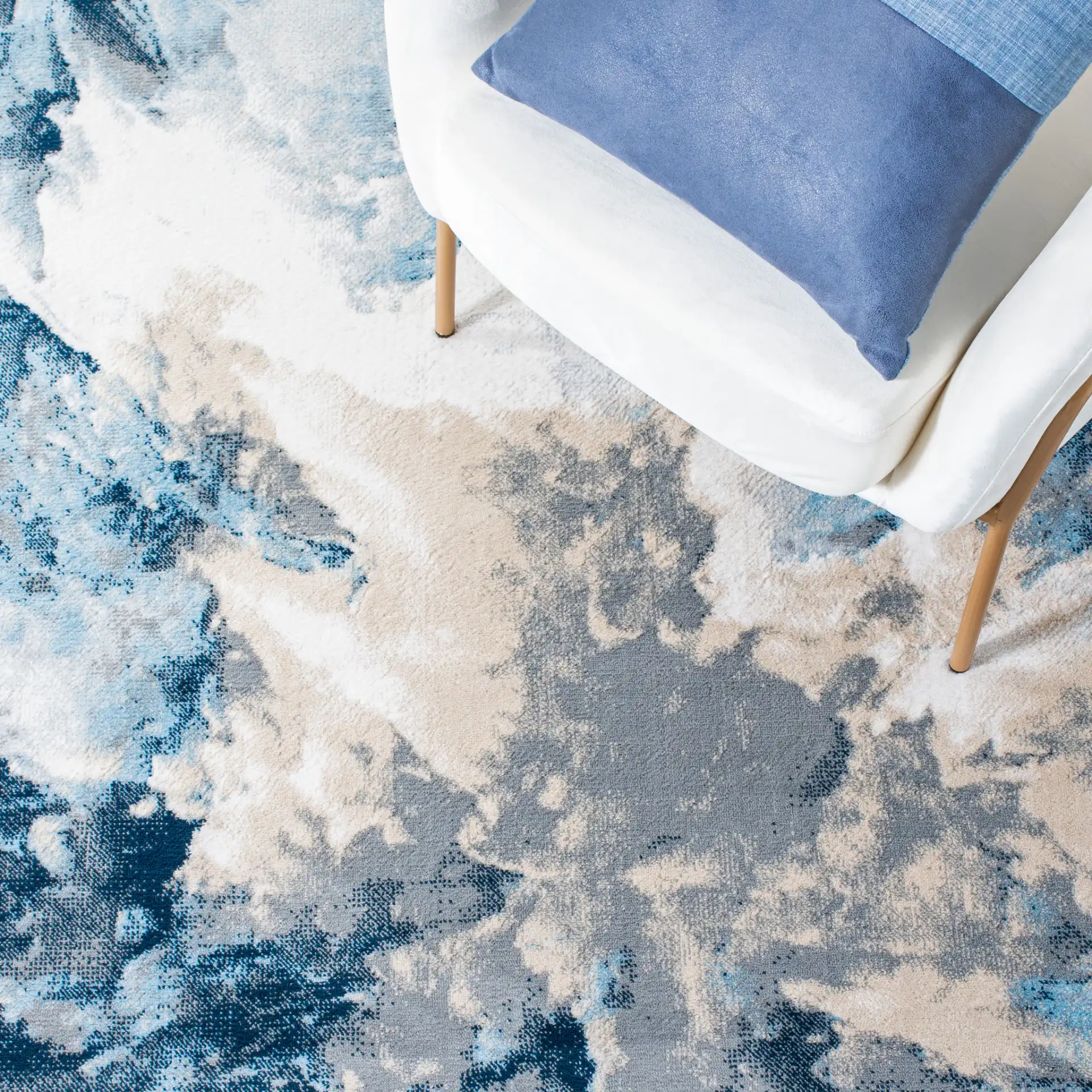 Lagoon Abstract Cloud Rug in Blue / Beige in a styled room