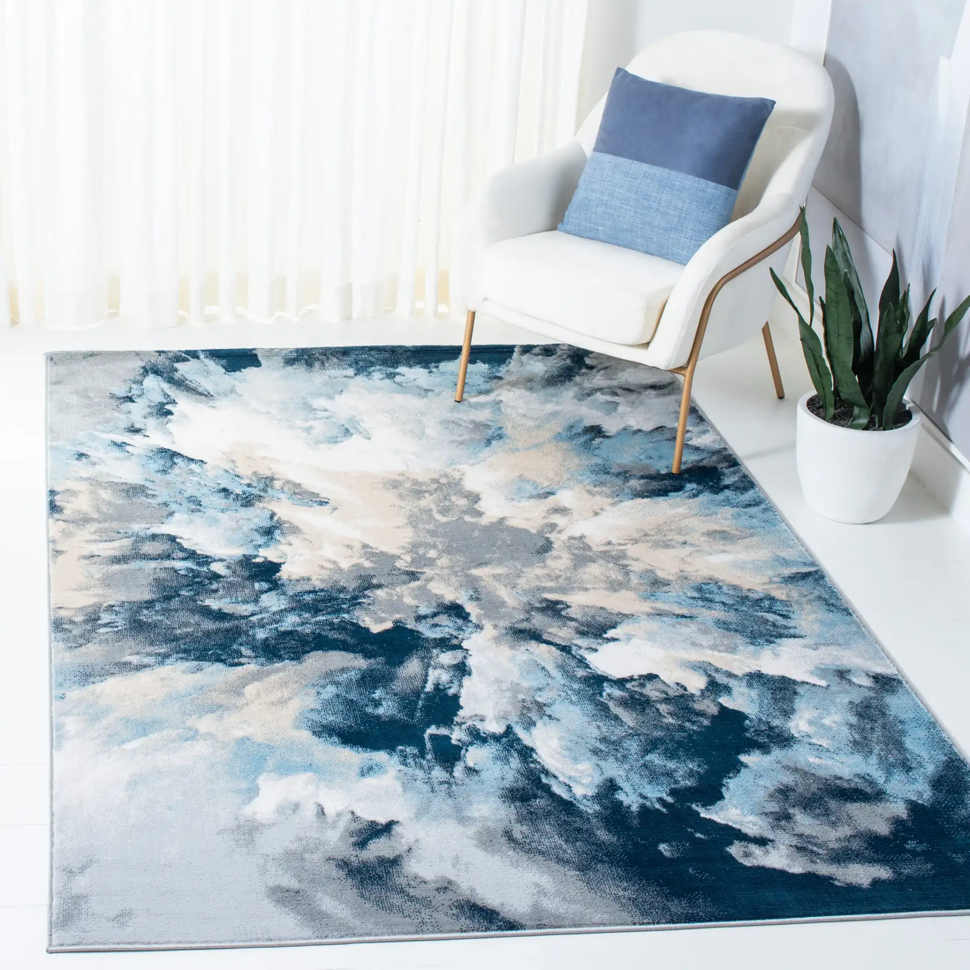 Lagoon Abstract Cloud Rug in Blue / Beige in a styled room