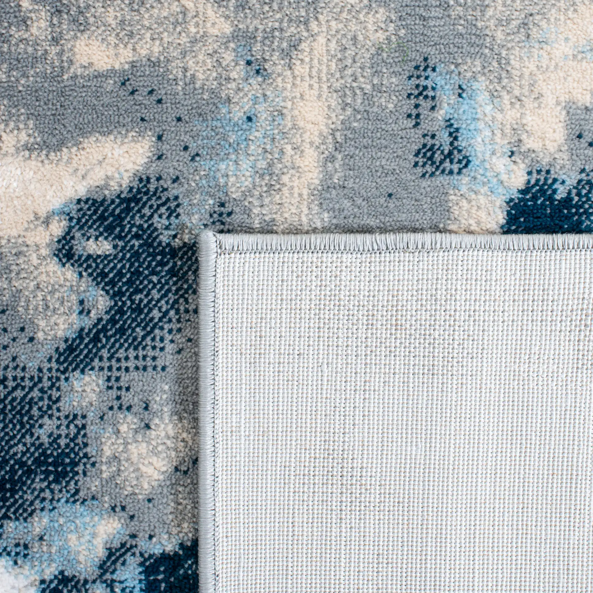 Lagoon Abstract Cloud Rug in Blue / Beige in a styled room