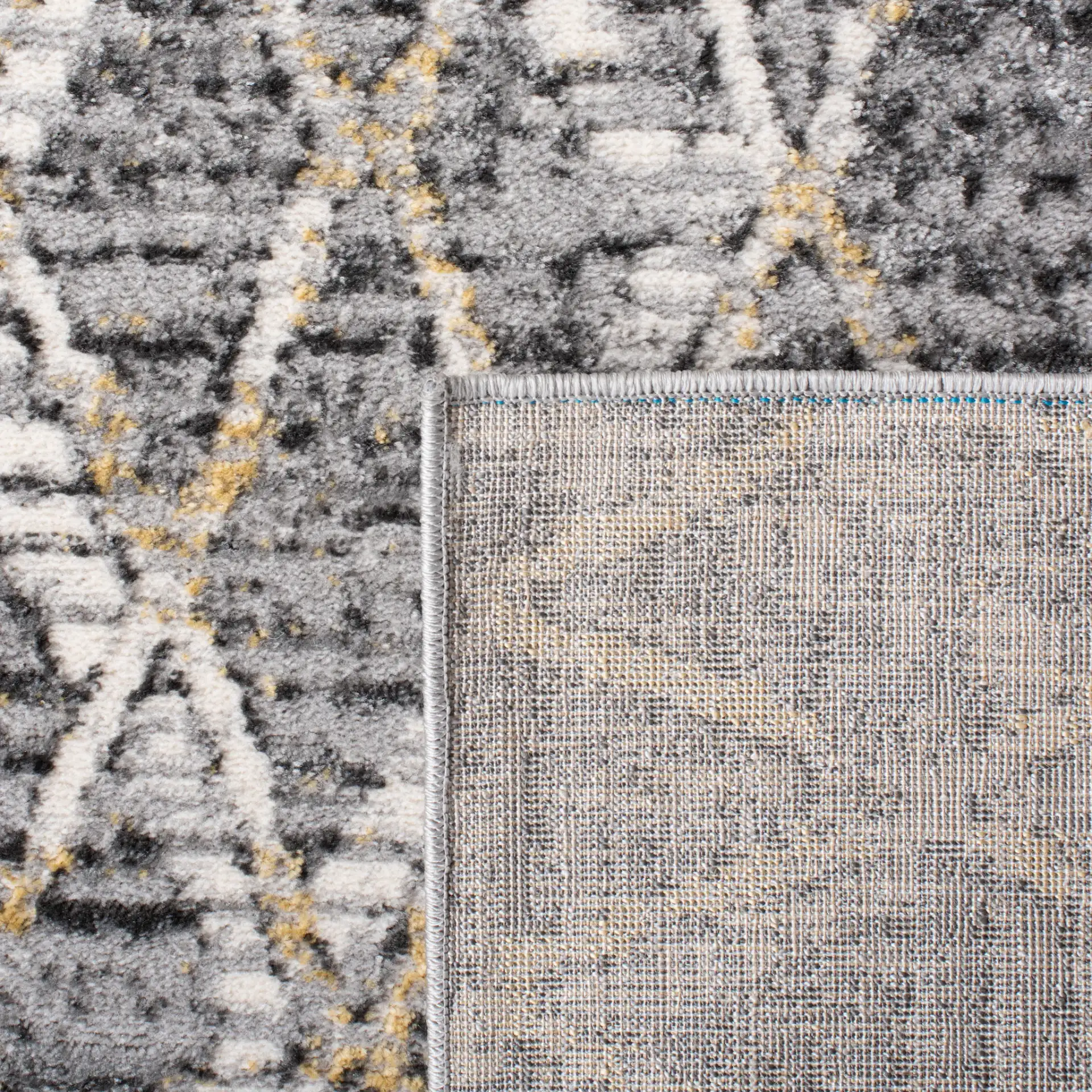 Lagoon Diamond Lattice Rug in Gray / Gold in a styled room