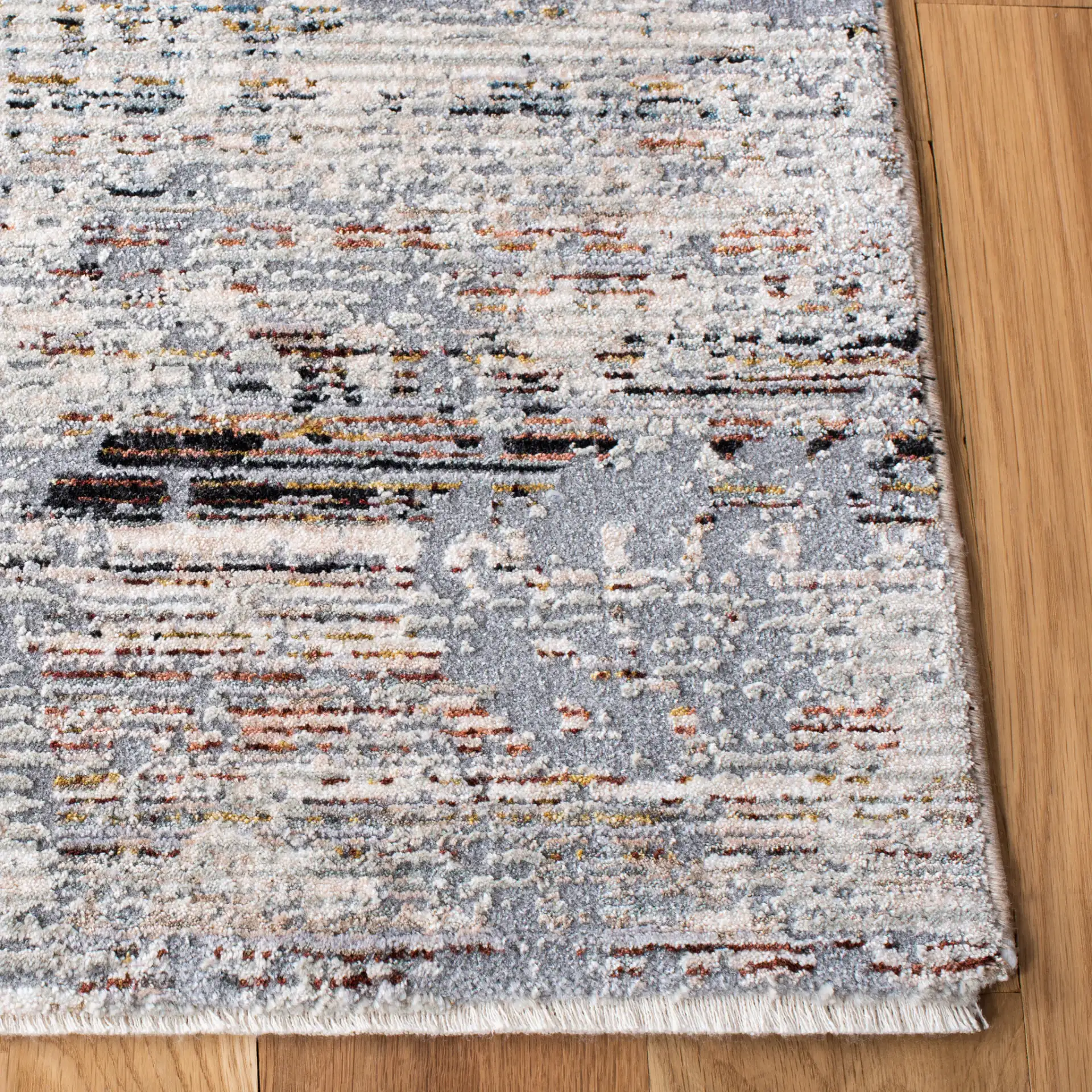 Limitee Distressed Abstract Rug in Gray / Beige in a styled room