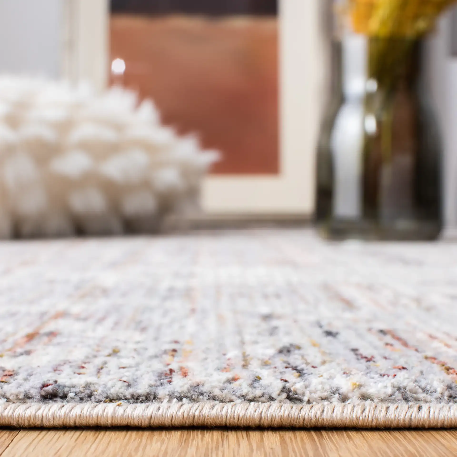 Limitee Distressed Abstract Rug in Gray / Beige in a styled room