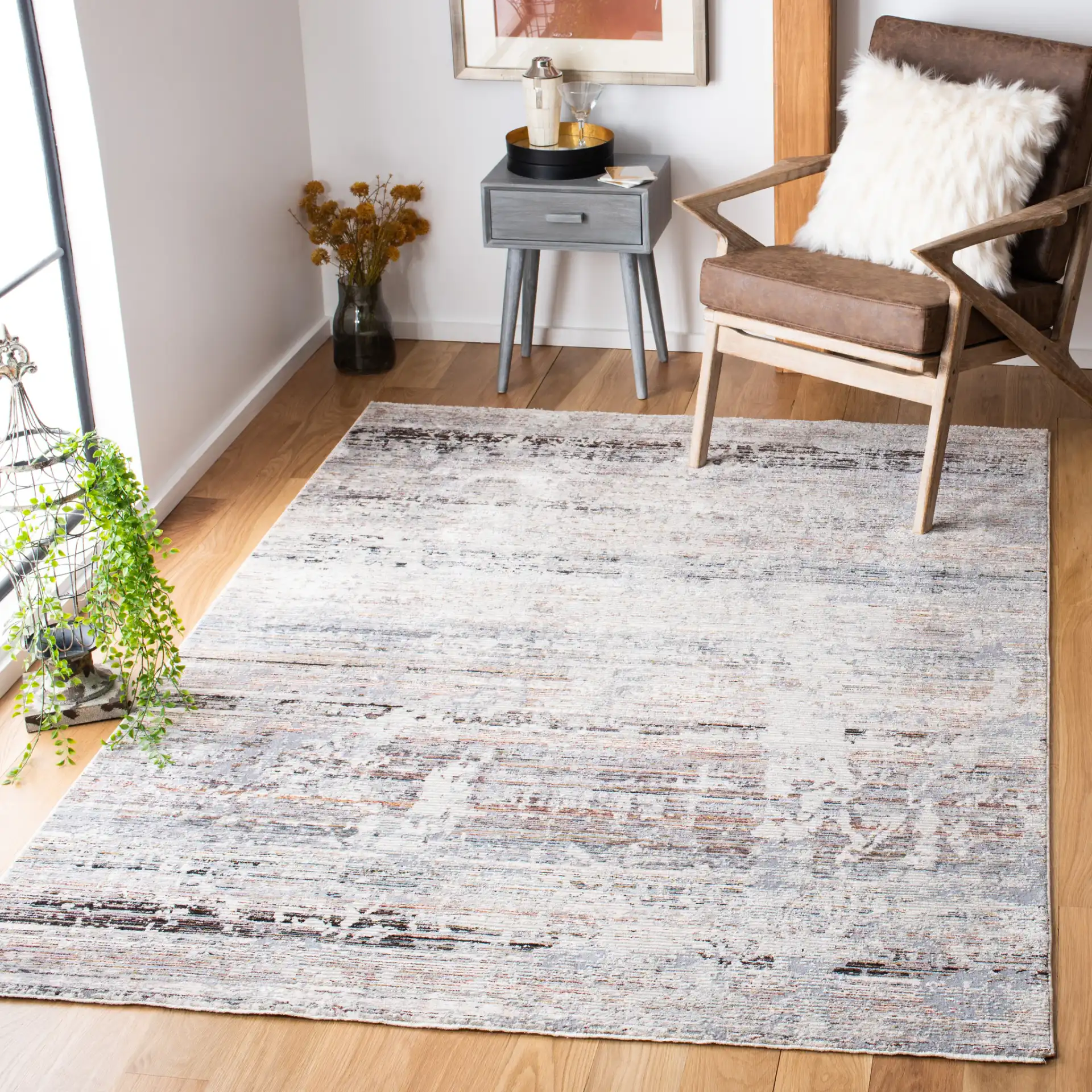 Limitee Distressed Abstract Rug in Gray / Beige in a styled room