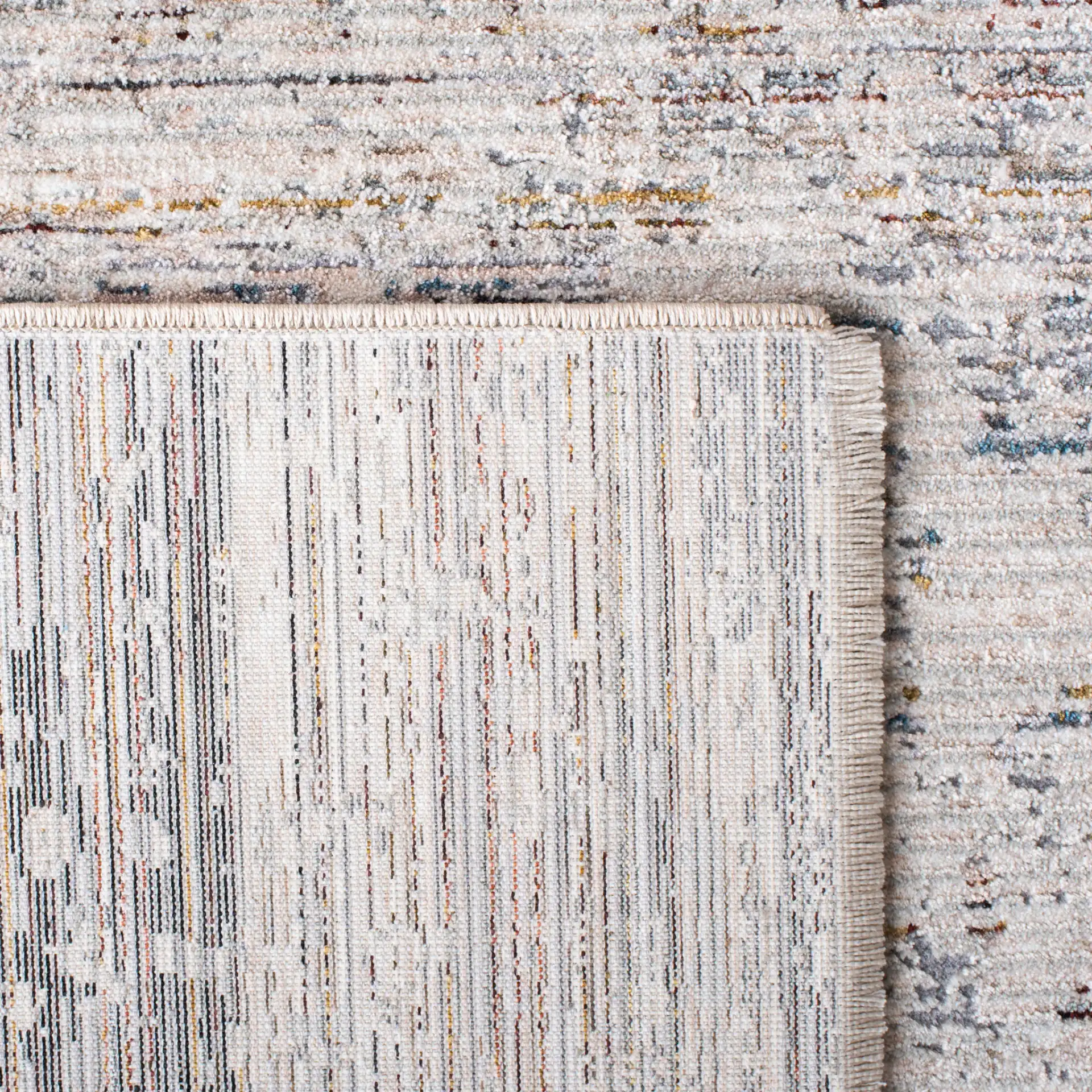 Limitee Distressed Abstract Rug in Gray / Beige in a styled room