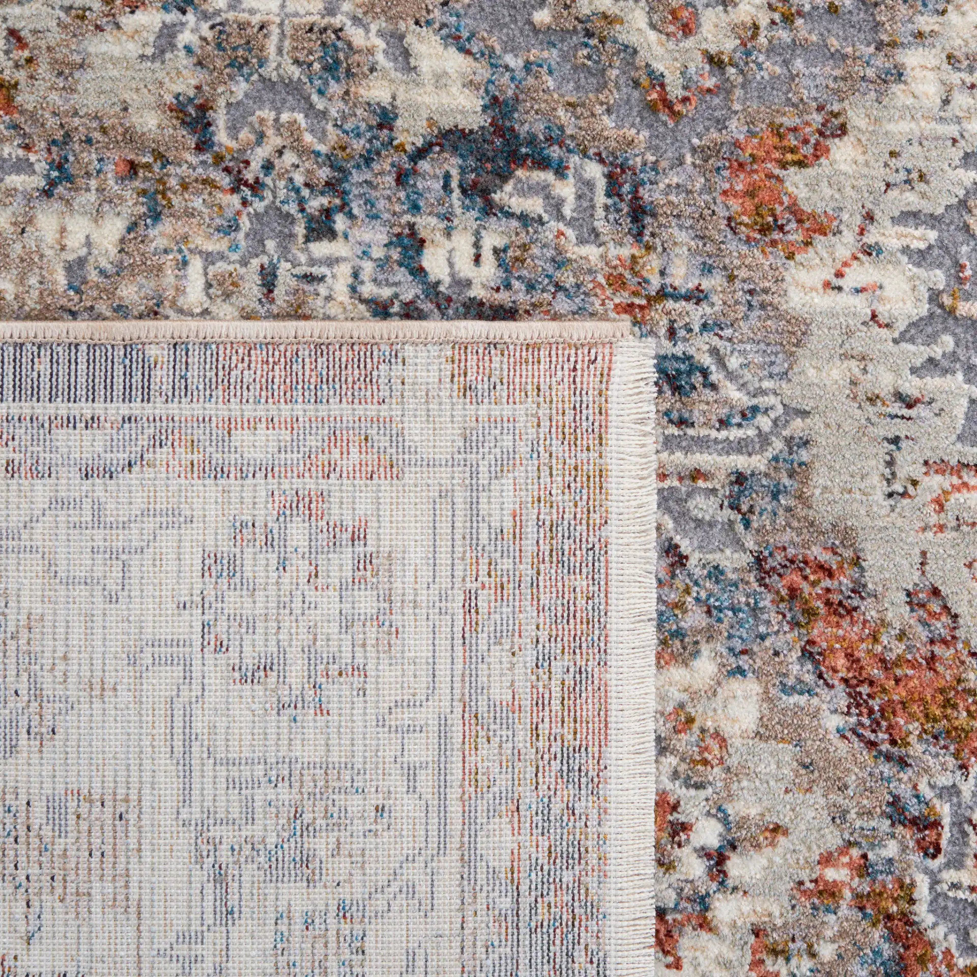 Limitee Distressed Floral Border Rug in Charcoal / Beige in a styled room
