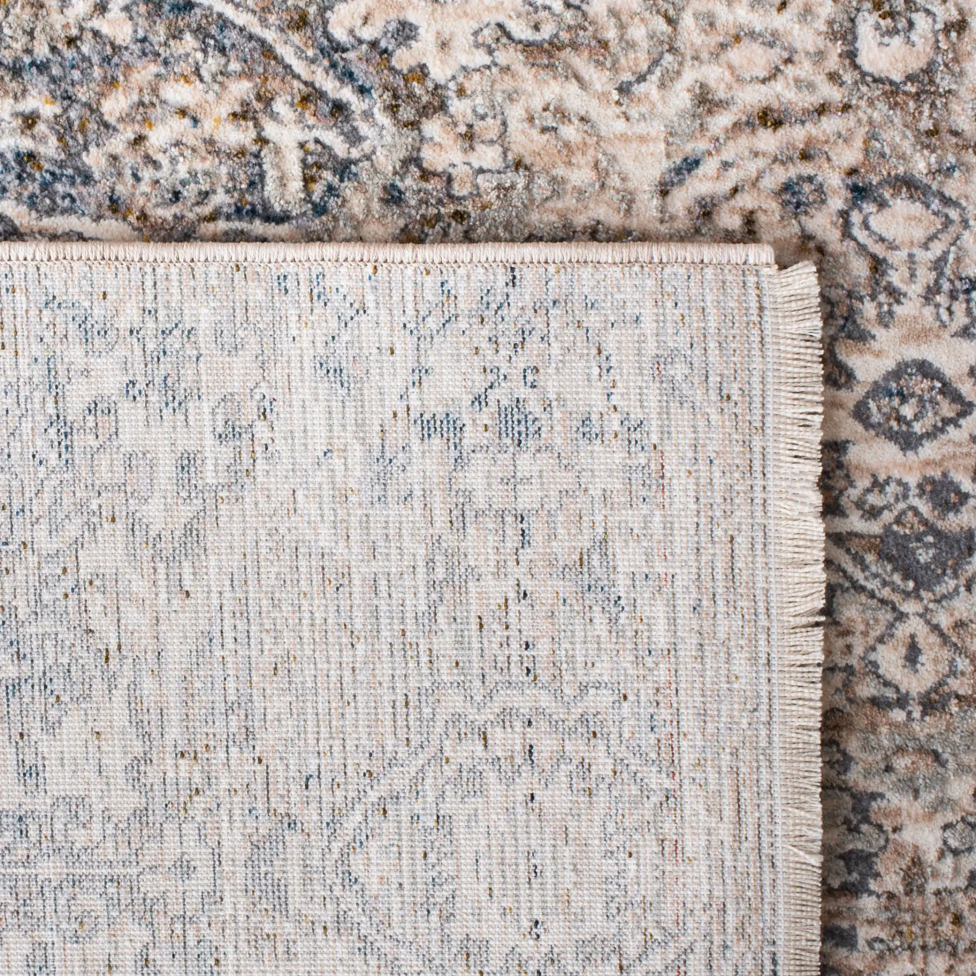 Limitee Distressed Damask Rug in Beige in a styled room