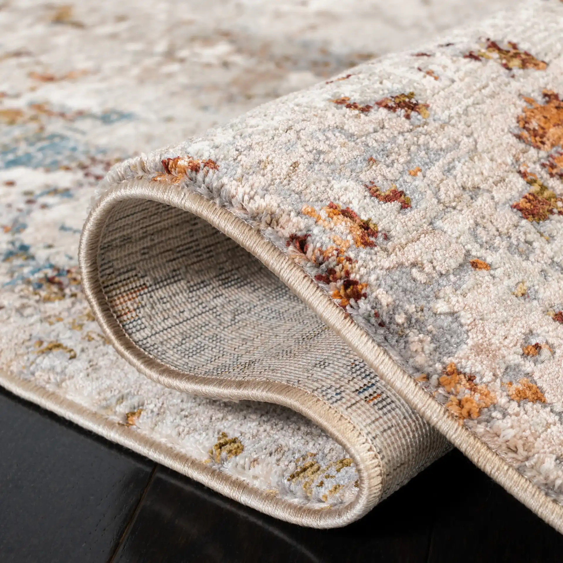 Limitee Mottled Abstract Rug in Beige in a styled room