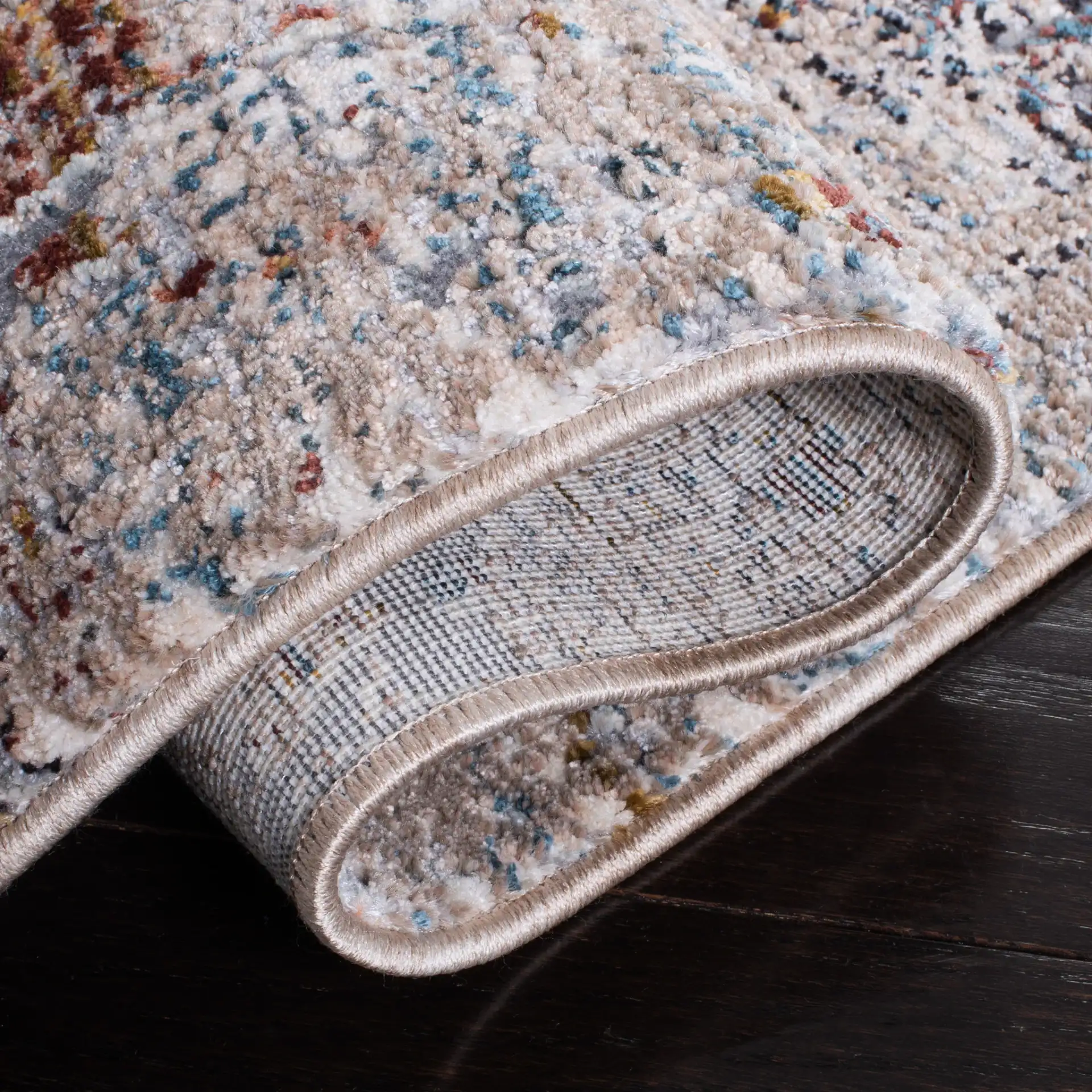 Limitee Distressed Bordered Rug in Beige in a styled room