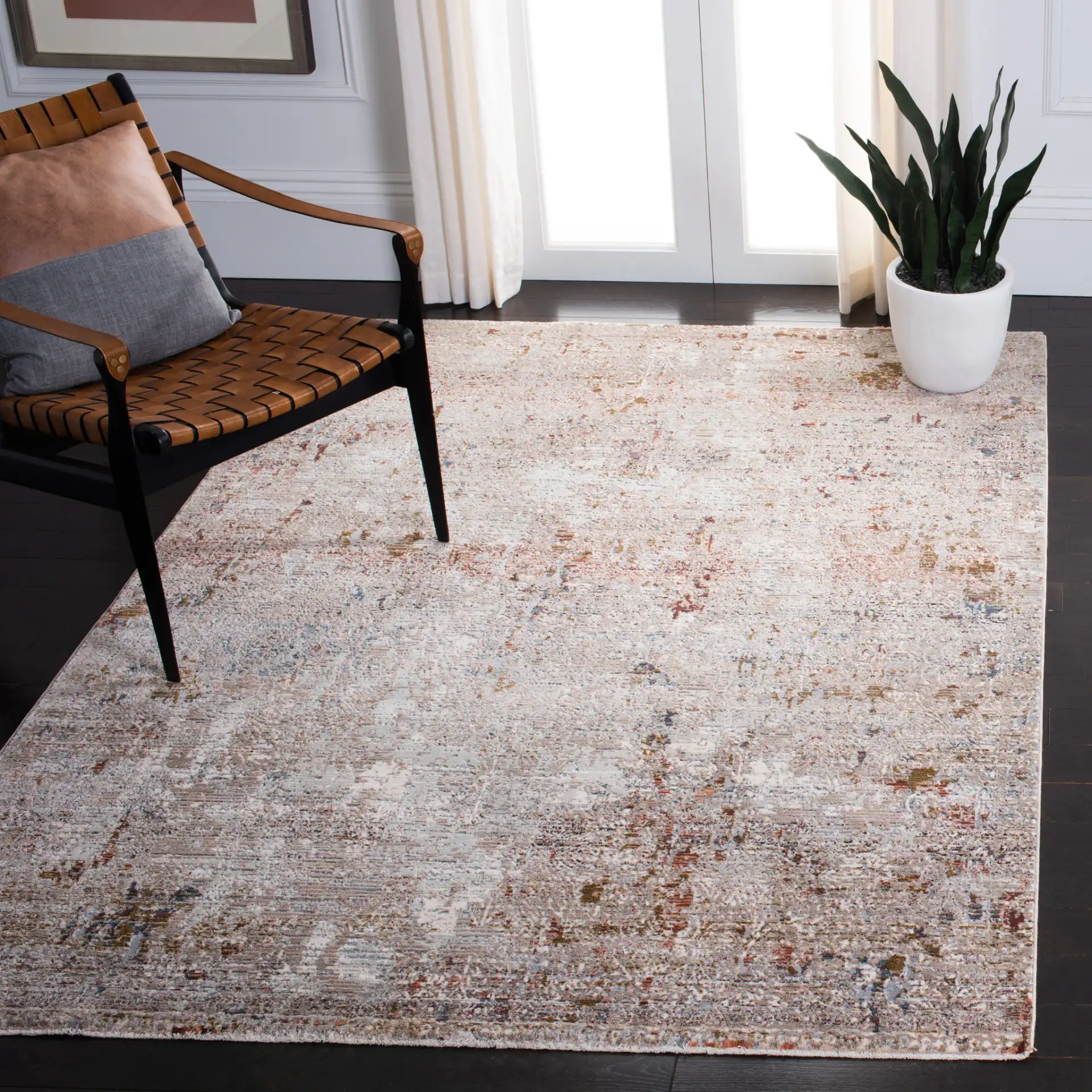 Limitee Distressed Bordered Rug in Beige in a styled room