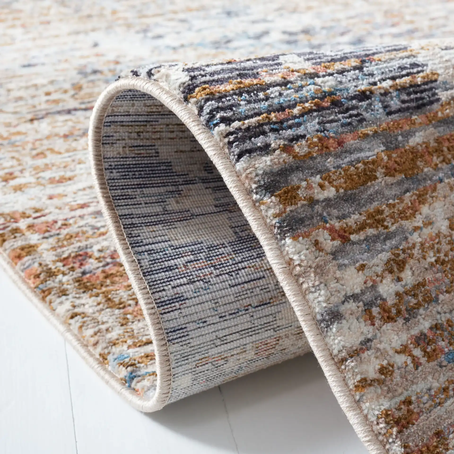 Limitee Striated Abstract Rug in Beige in a styled room