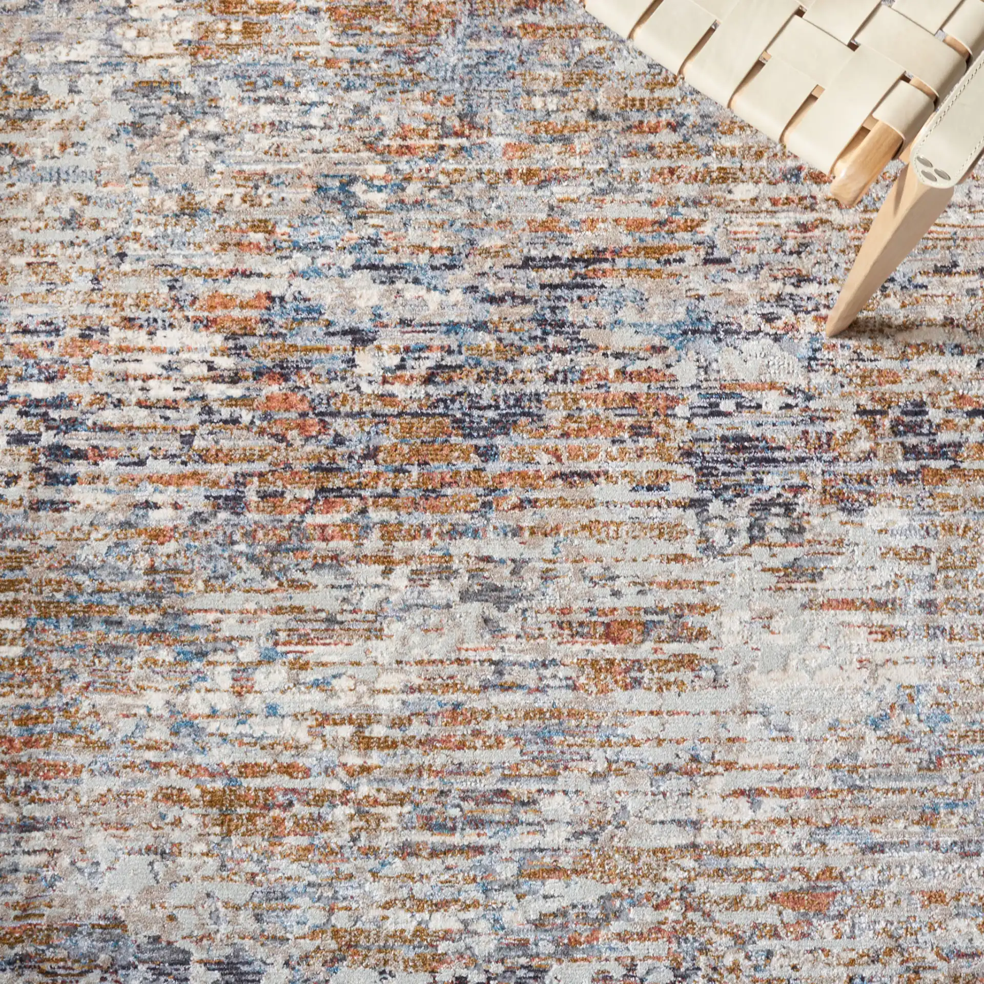 Limitee Striated Abstract Rug in Beige in a styled room