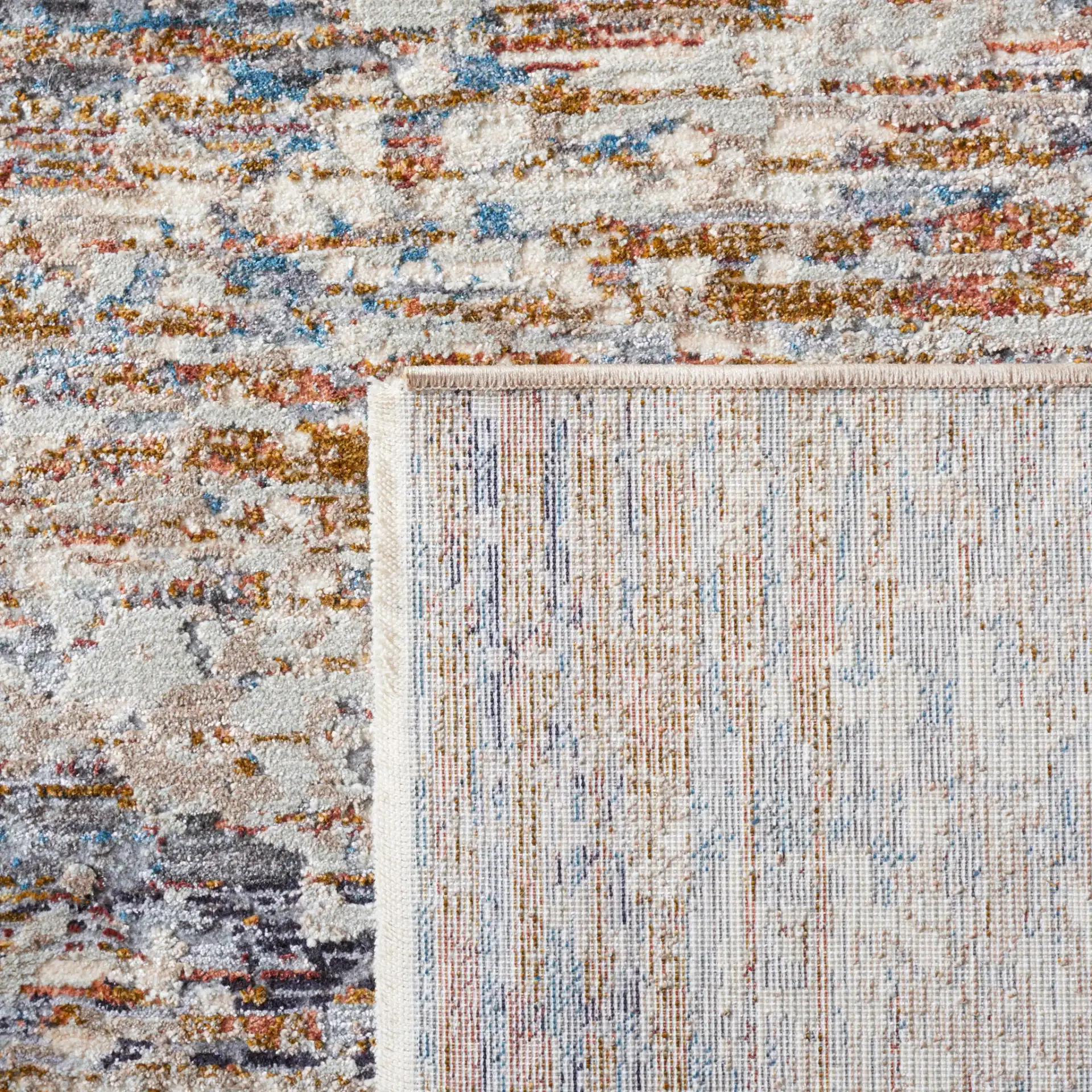 Limitee Striated Abstract Rug in Beige in a styled room
