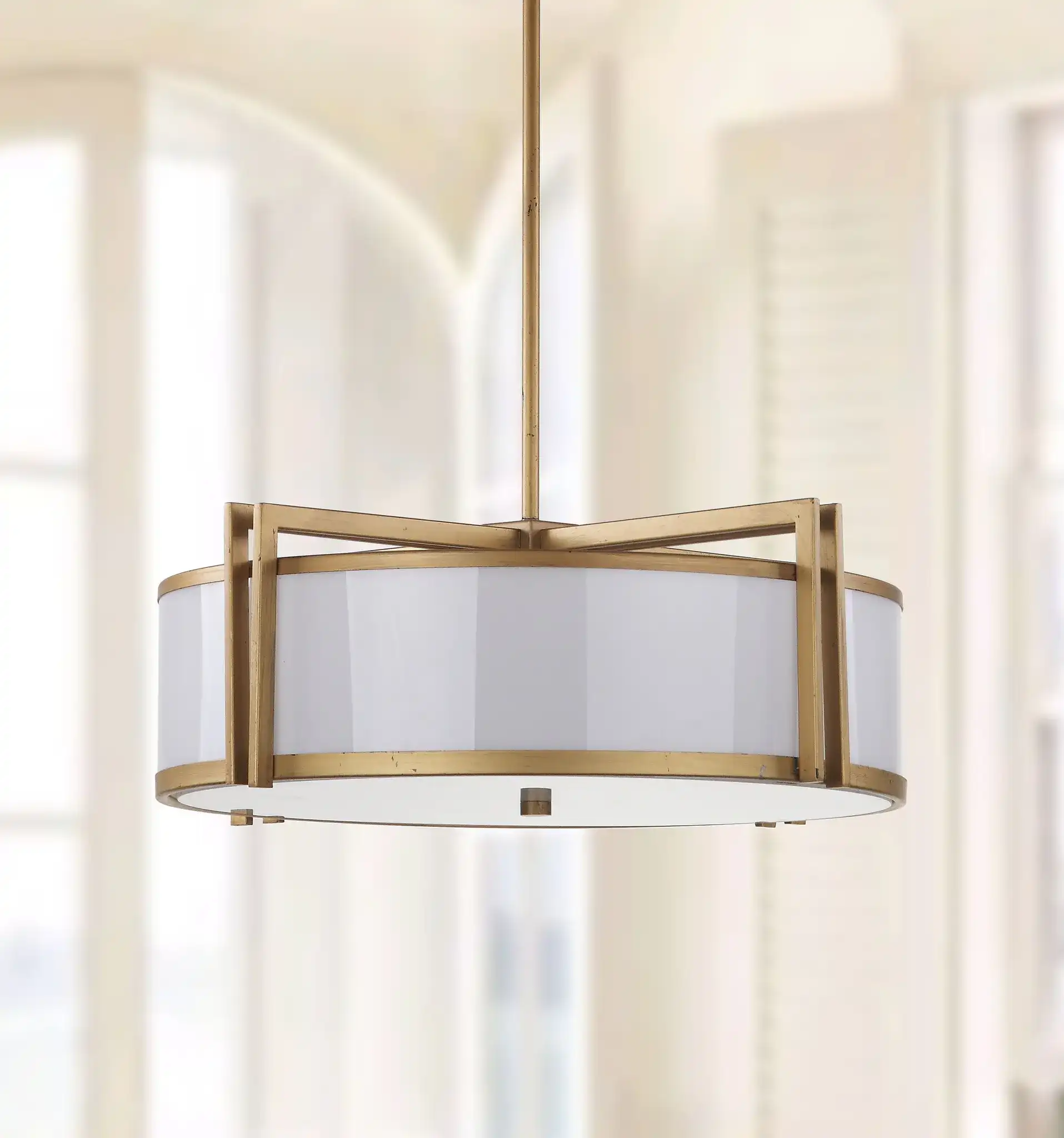 Orb Drum Pendant in Gold in a styled room