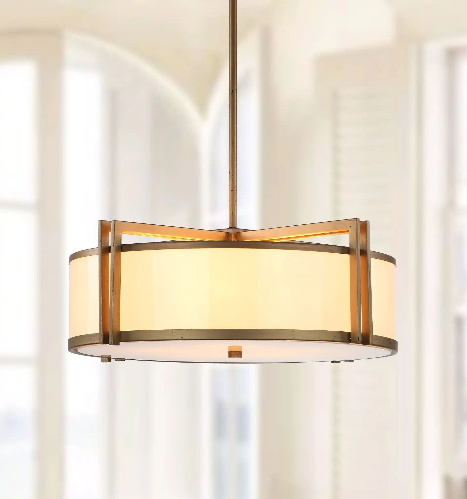 Orb Drum Pendant in Gold in a styled room