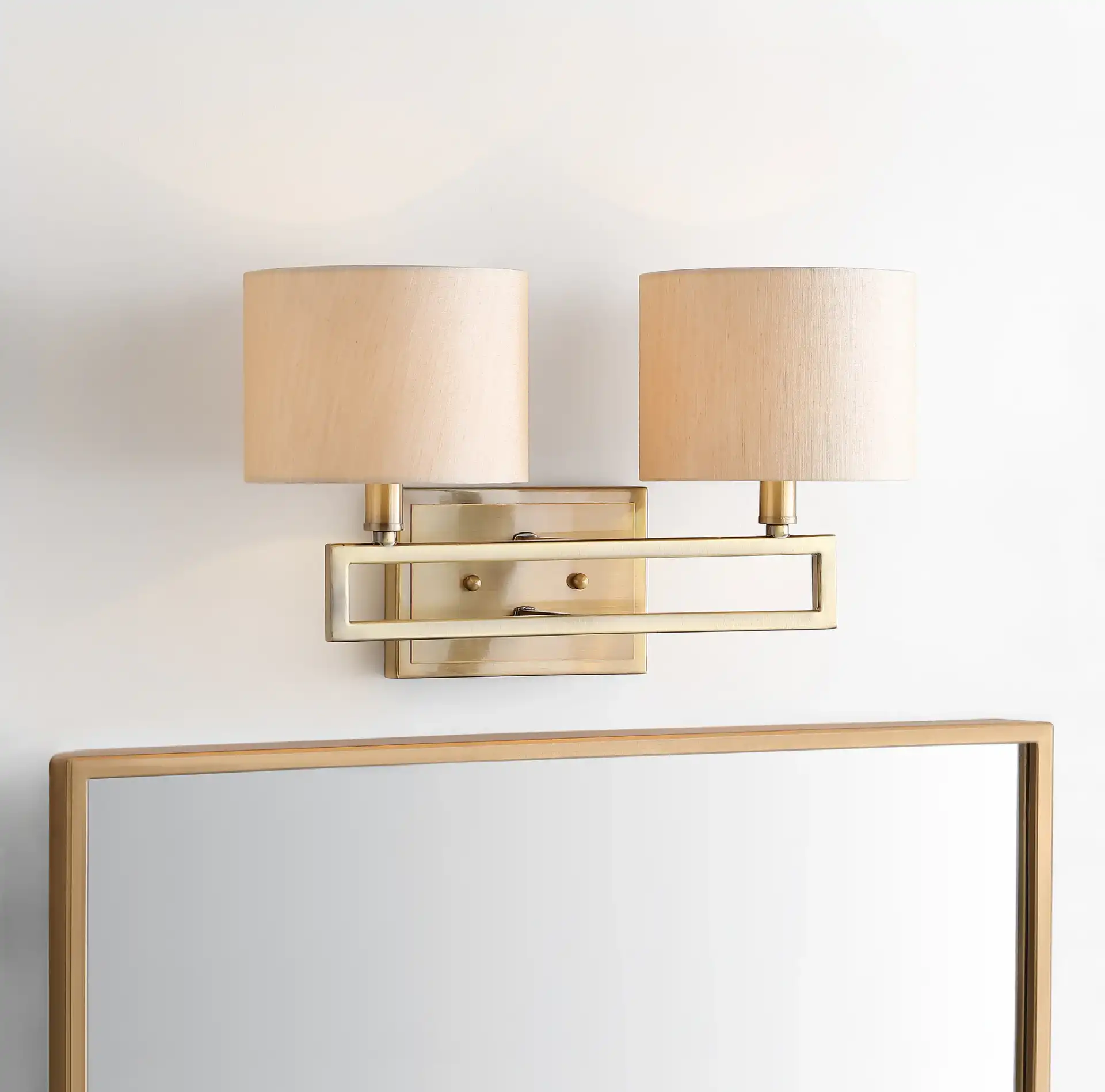 Catena Double Sconce in Gold in a styled room