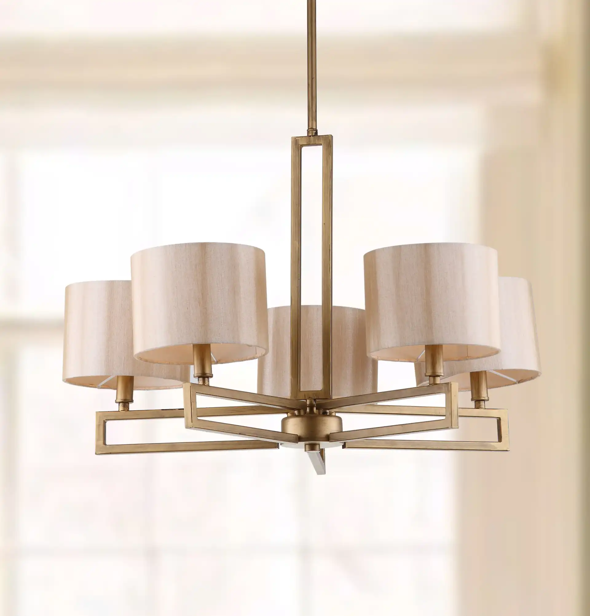 Catena Chandelier in Gold in a styled room
