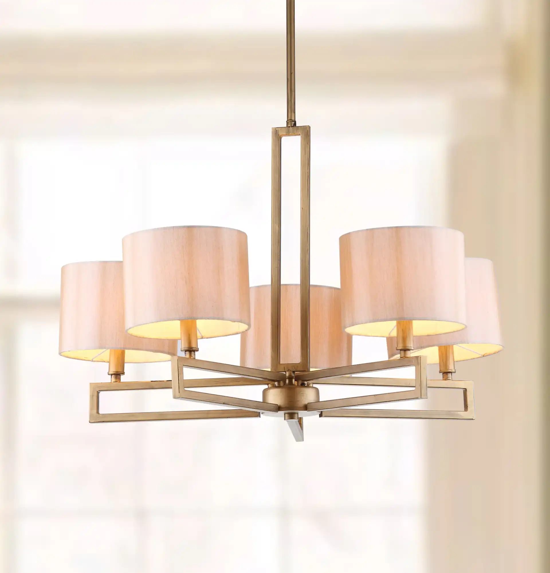 Catena Chandelier in Gold in a styled room